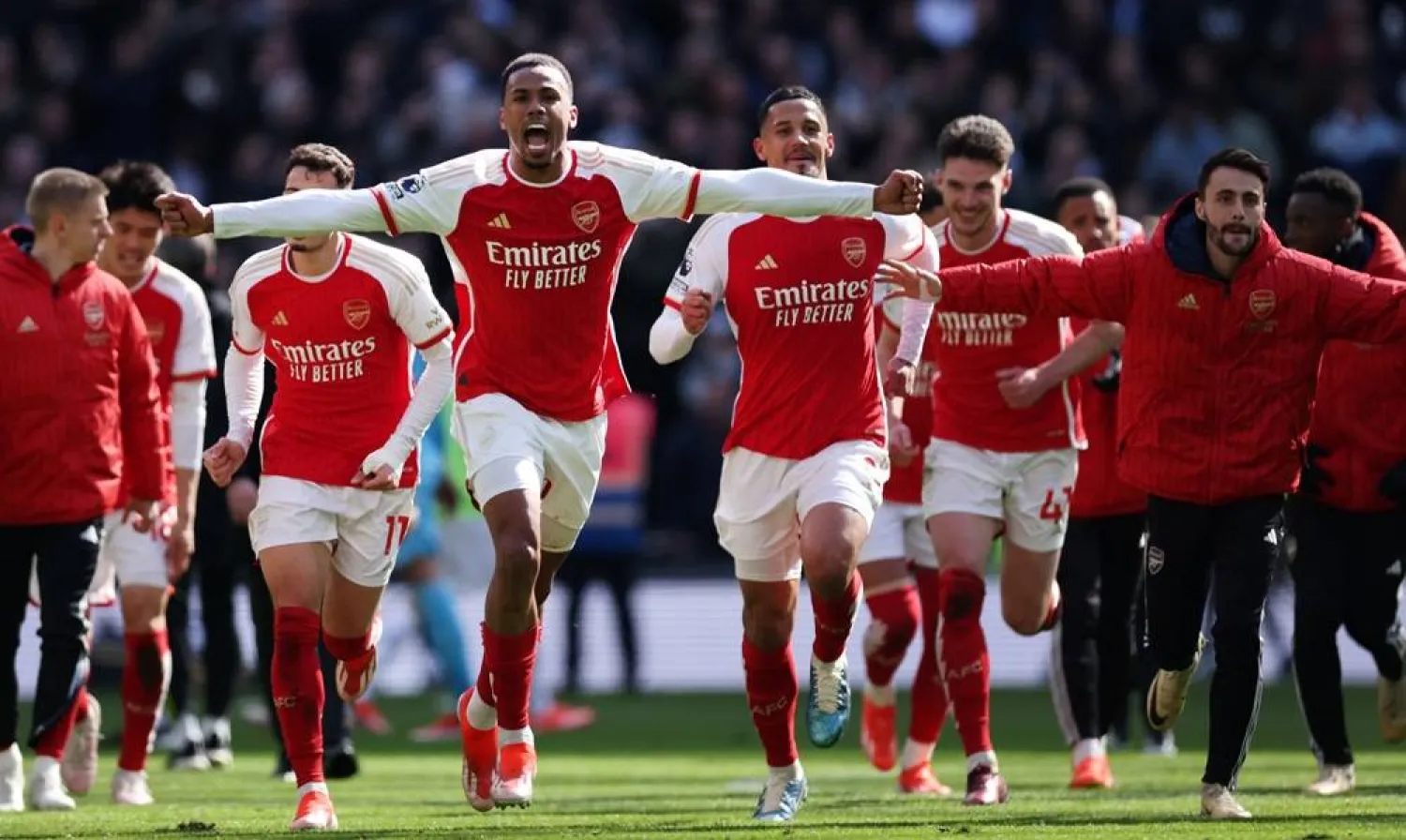 Gabriel (L) of Arsenal and his teammates celebrate their 3-2 win after the English Premier League soccer match between Tottenham Hotspur against Arsenal FC in London, Britain, 28 April 2024. (EPA)