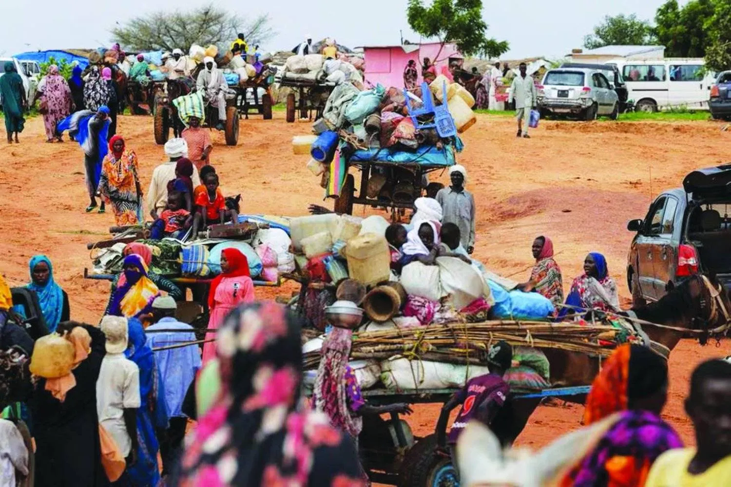Sudanese people who fled the conflict in Darfur while crossing the border into Chad on August 4, 2023 (Reuters)