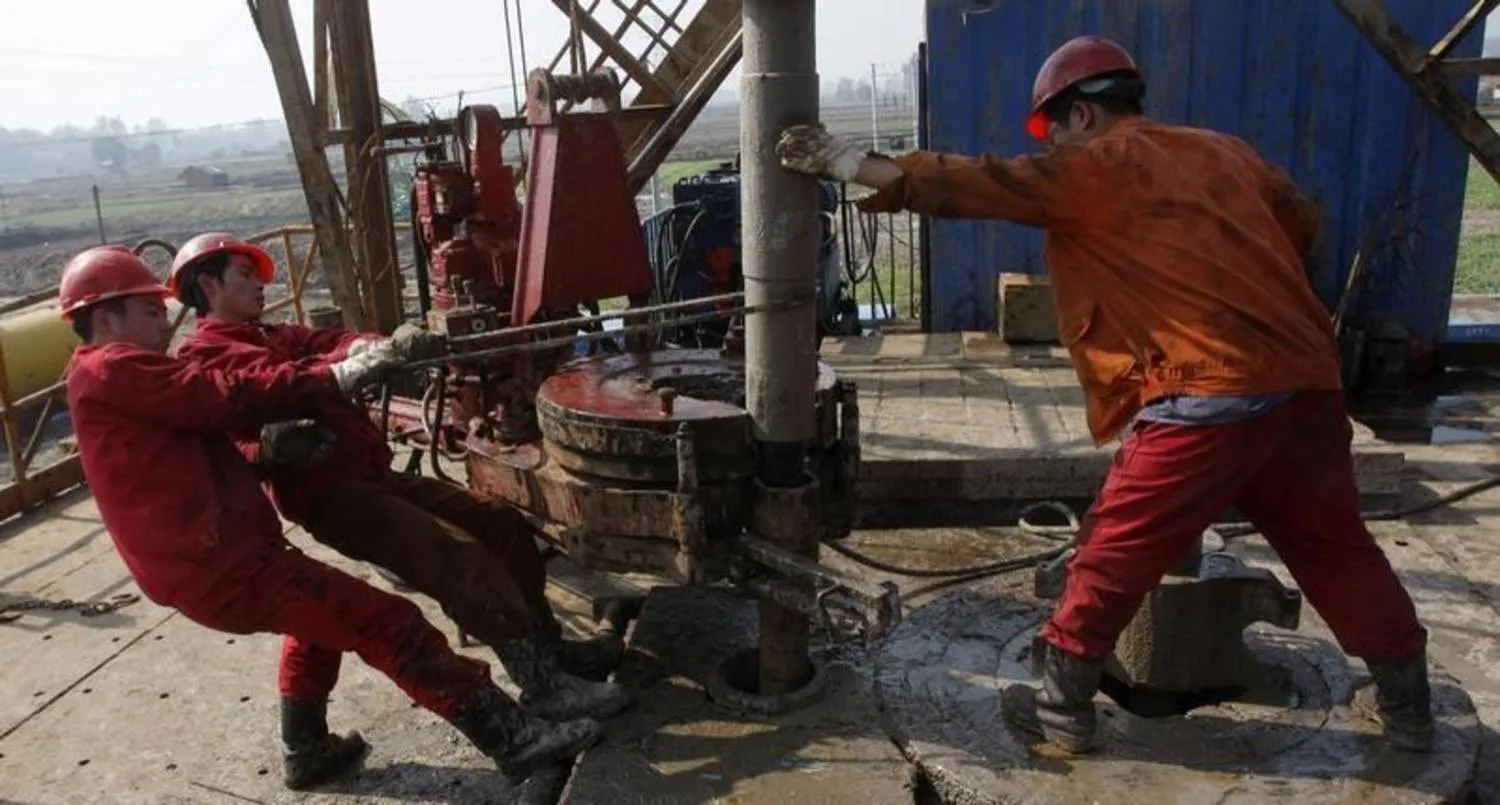 Workers in an oil field in Hubei Province, China (Reuters)