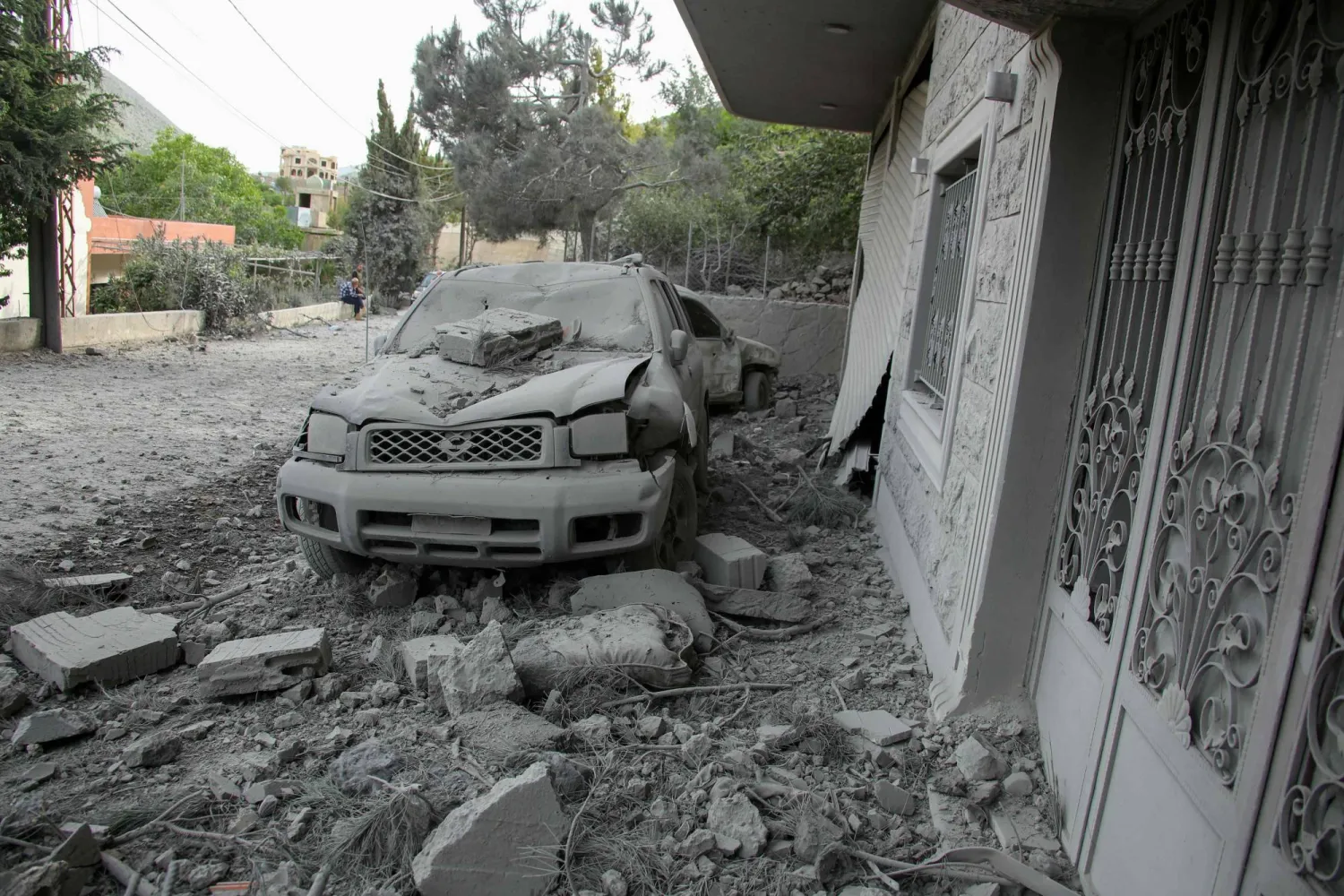 Rubble litters the area around a house which was hit overnight by an Israeli airstrike in the southern Lebanese village of Shebaa near the border on April 26, 2024. (Photo by Rabih DAHER / AFP)