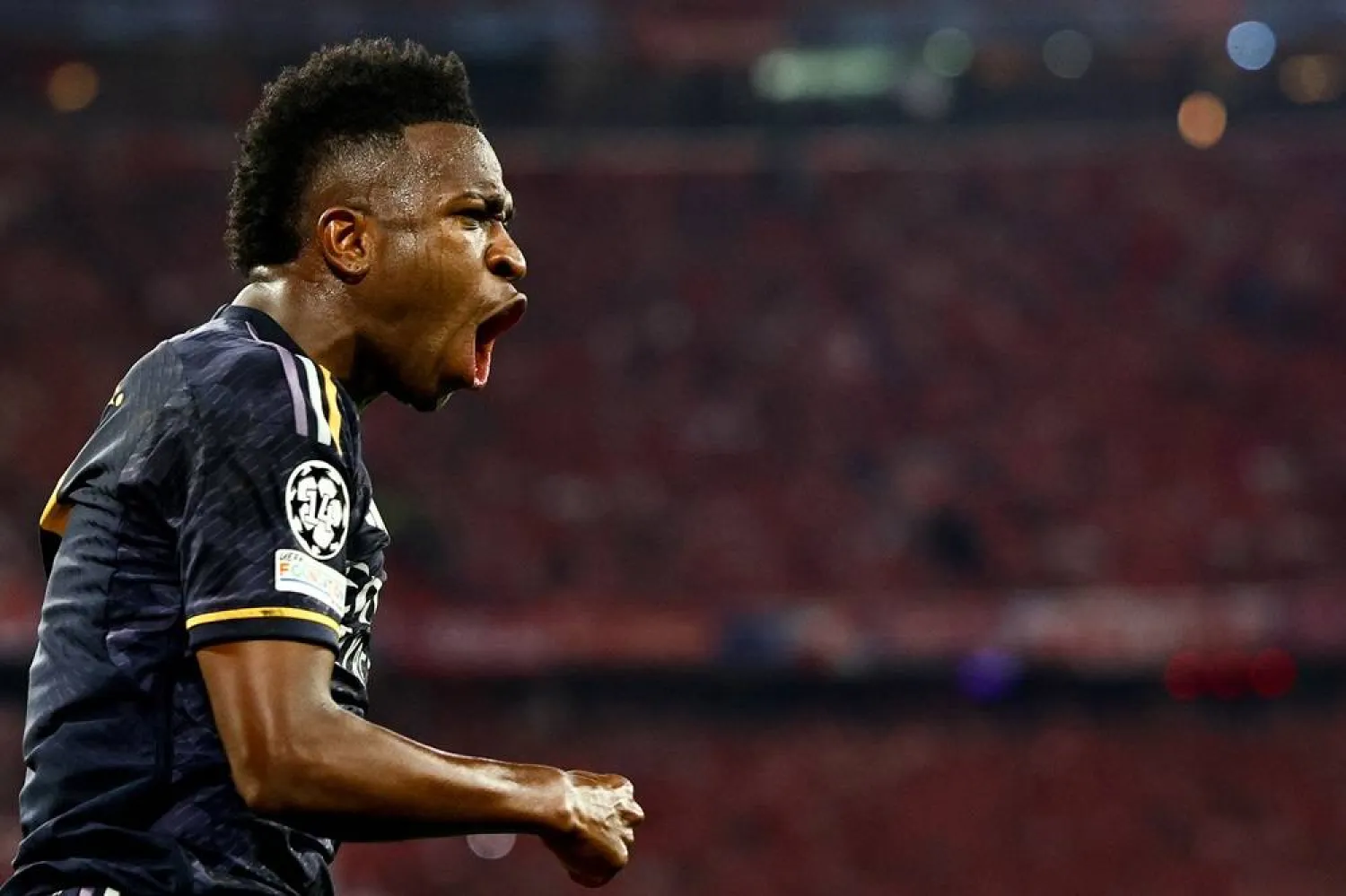 Real Madrid's Vinícius Júnior celebrates after scoring the 2-2 equalizer during the UEFA Champions League semi final, 1st leg match between Bayern Munich and Real Madrid in Munich, Germany, 30 April 2024. (EPA)