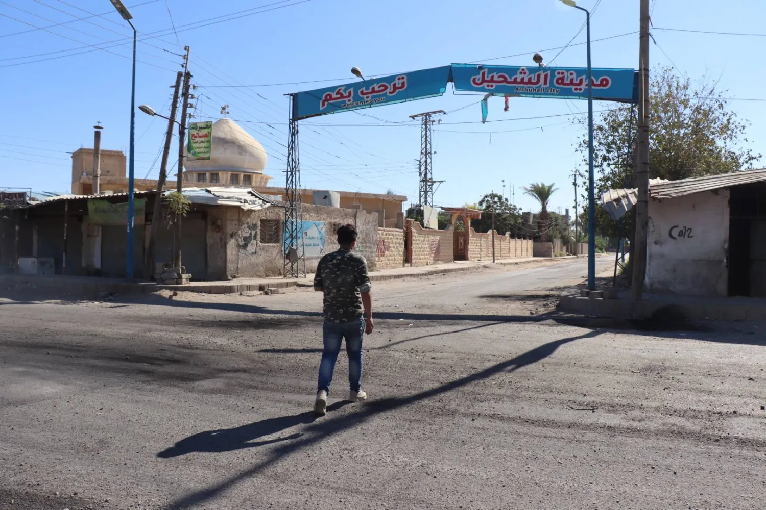 A Syrian man walks across an empty street at Shehel after the Kurdish-led, US-backed Syrian Democratic Forces (SDF) imposed their control over the town, in Deir ez-Zor province, eastern Syria, 09 September 2023. EPA/AHMED MARDNLI