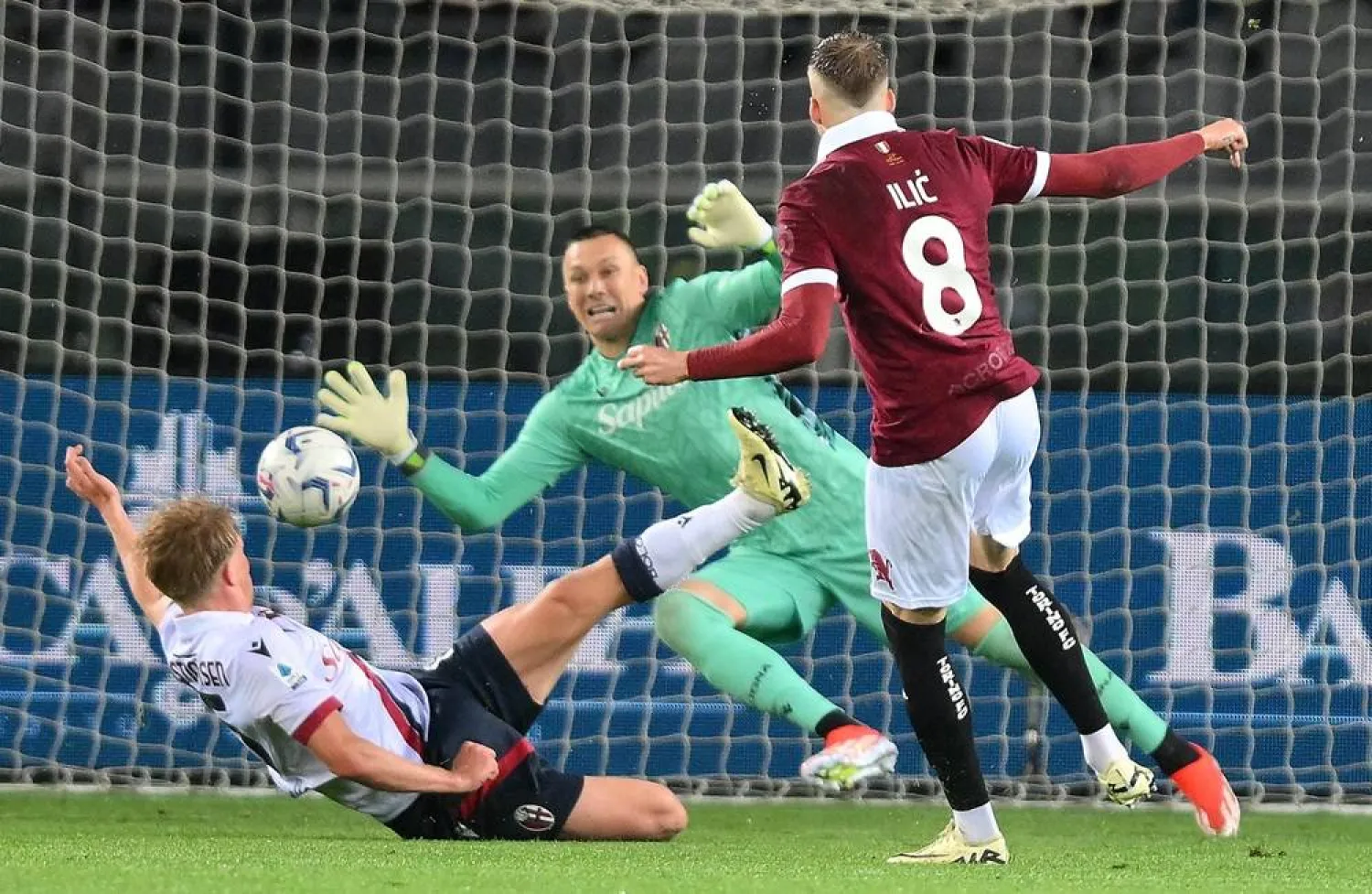 Torino's Ivan Ilic (R) takes a shot on goal during the Italian Serie A soccer match Torino FC vs Bologna FC at the Olimpico Grande Torino Stadium in Turin, Italy, 03 May 2024. (EPA)