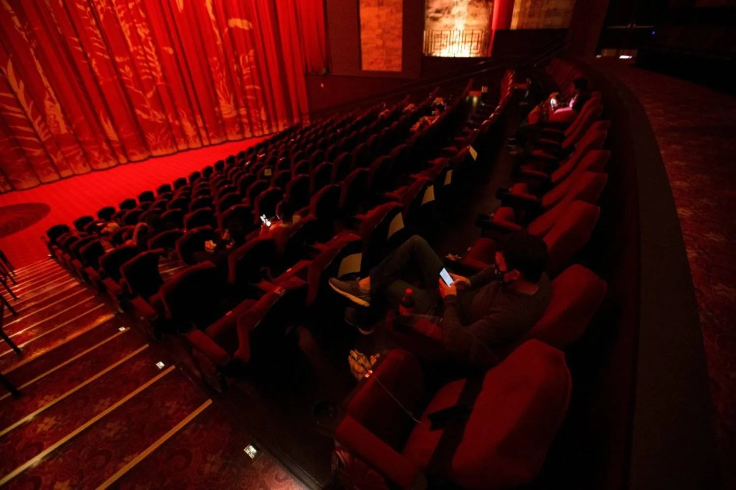  Representation photo: Moviegoers sit socially distanced as they wait for the movie "Godzilla vs. Kong" on the reopening day of the TCL Chinese theater during the outbreak of the coronavirus, Los Angeles, California, US, March 31, 2021. (Reuters Photo)
