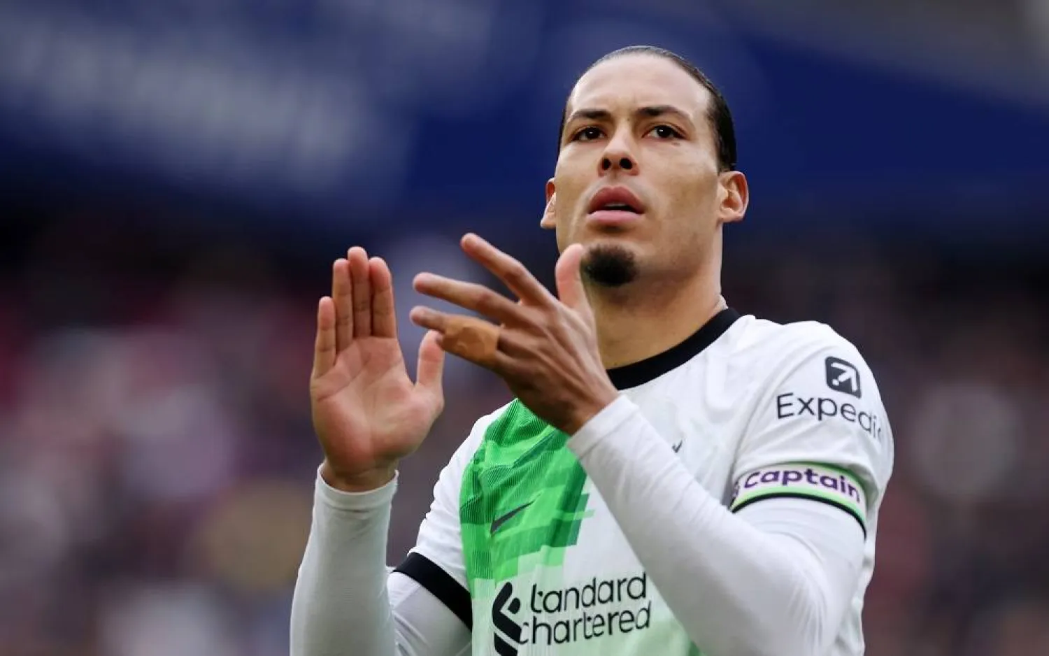 Liverpool captain Virgil van Dijk greet supporters following the English Premier League soccer match between West Ham United and Liverpool in London, Britain, 27 April 2024. (EPA)