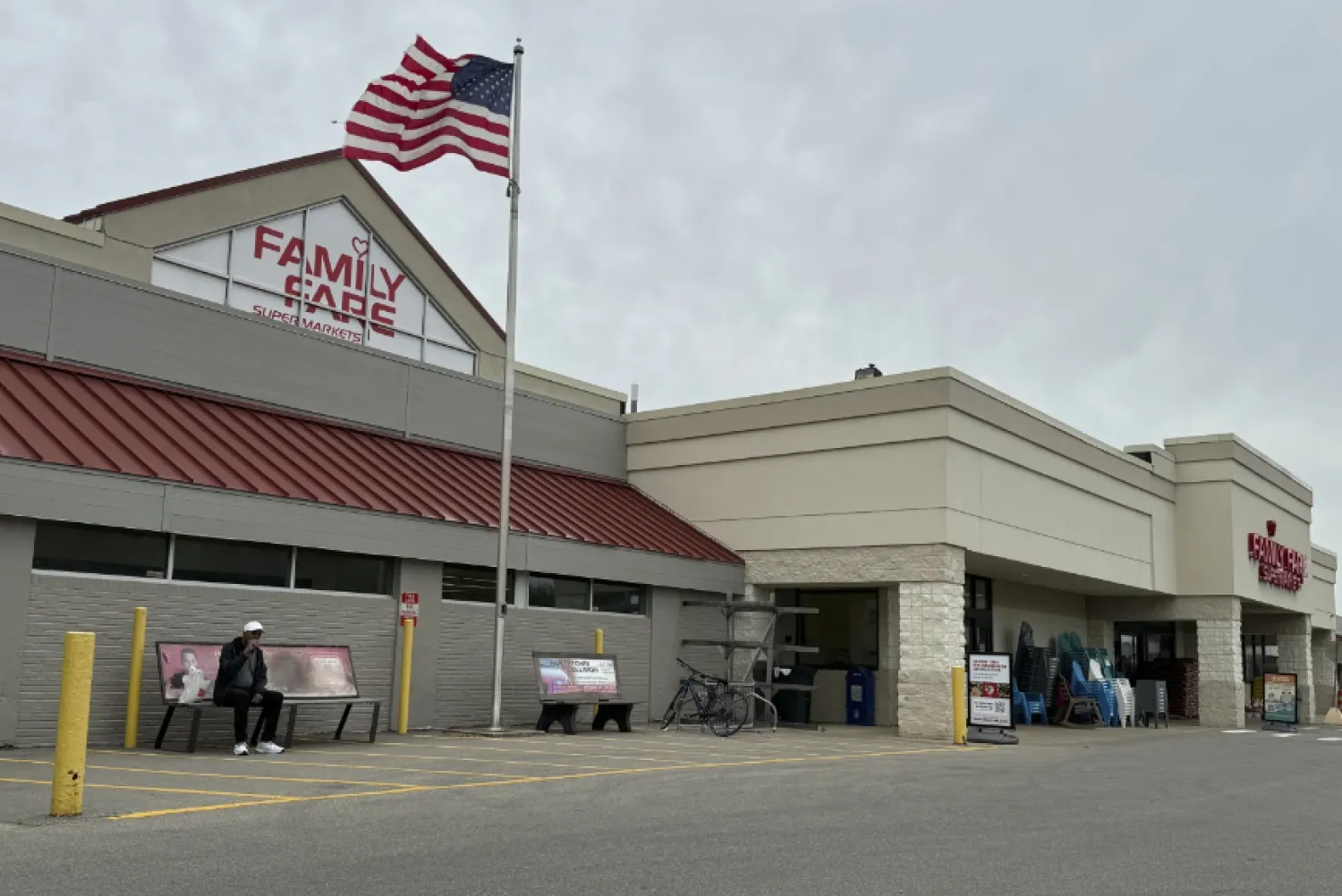 The Family Fare store is in a retail strip with a triangle-shaped sign at the top of the building.  (The AP)
