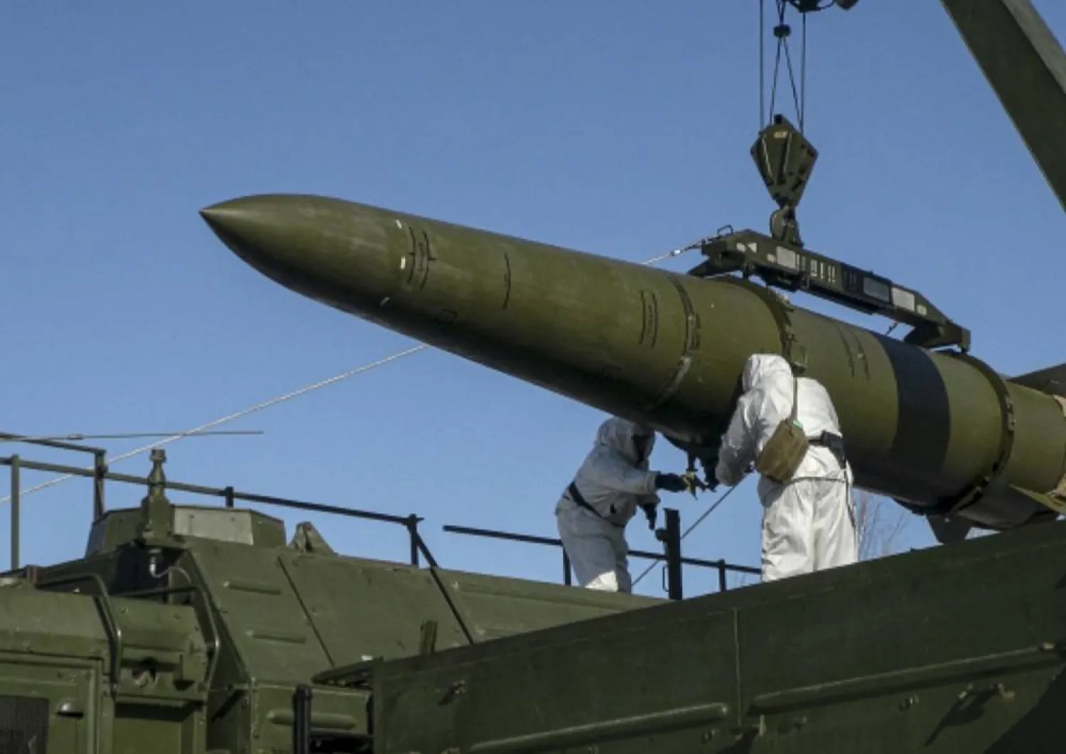 In this photo released by Russian Defense Ministry Press Service on Friday, Feb. 2, 2024, Russian troops load an Iskander missile onto a mobile launcher during drills at an undisclosed location in Russia. (Russian Defense Ministry Press Service via AP, File) 