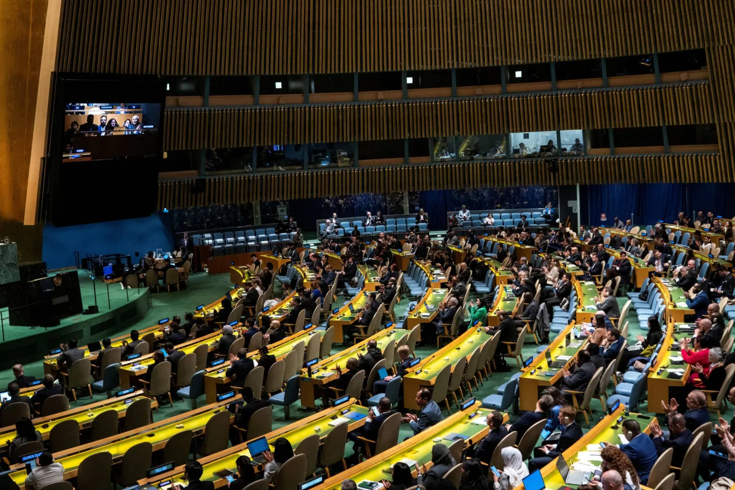 FILE PHOTO: Delegates react to the voting results during the United Nations General Assembly vote on a draft resolution that would recognize the Palestinians as qualified to become a full UN member, in New York City, US May 10, 2024. REUTERS/Eduardo Munoz/File Photo