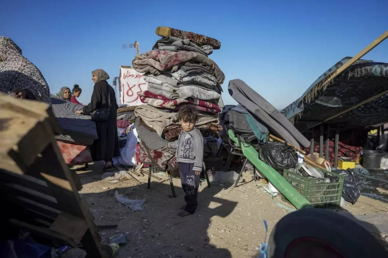 FILE - Displaced Palestinians arrive in central Gaza after fleeing from the southern Gaza city of Rafah in Deir al Balah, Gaza Strip, on Wednesday, May 8, 2024. (AP Photo/Abdel Kareem Hana, File) 