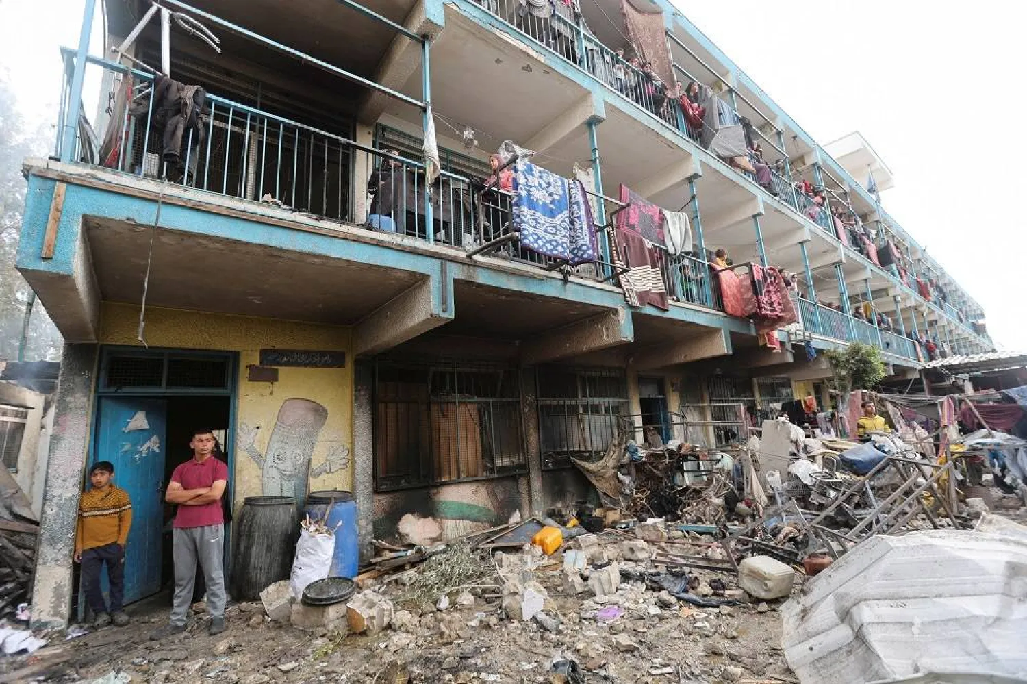 Palestinians inspect the site of an Israeli strike on a school sheltering displaced people, amid the ongoing conflict between Israel and the Palestinian group Hamas, in Nuseirat refugee camp in the central Gaza Strip, May 14, 2024. (Reuters)