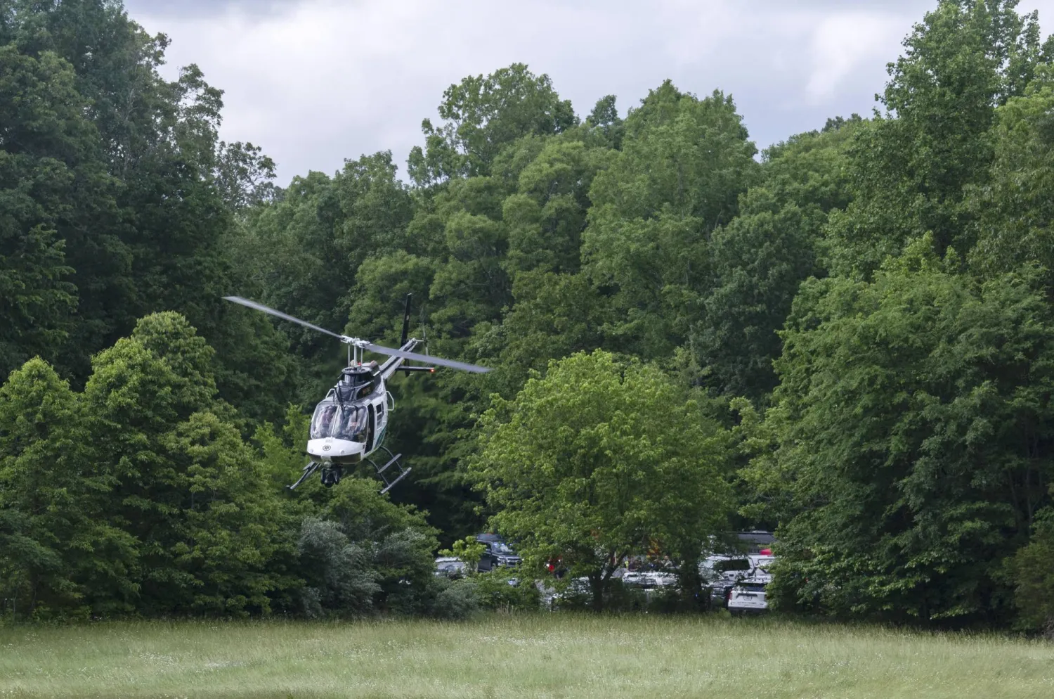 A helicopter takes flight near the site of a plane crash where three people were killed Wednesday, May 15, 2024, in Leipers Fork, Tenn. (Nicole Hester/The Tennessean via AP)