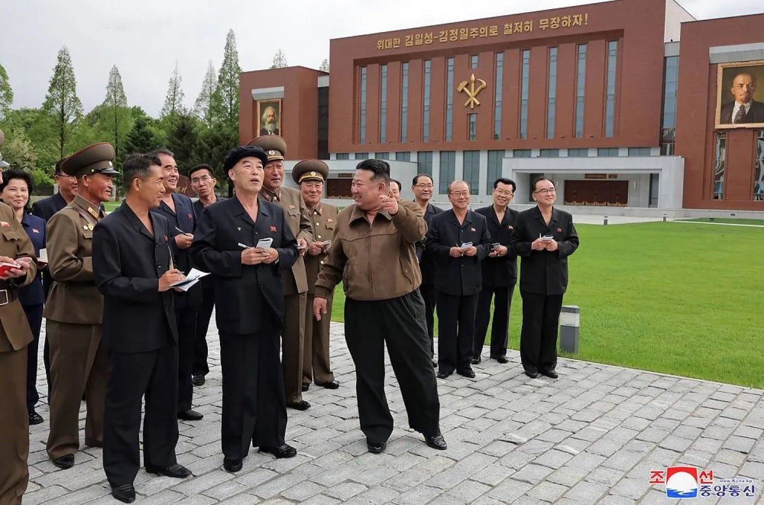 This picture taken on May 15, 2024 and released from North Korea's official Korean Central News Agency (KCNA) via KNS on May 16, 2024 shows North Korea's leader Kim Jong Un (C) inspecting the completed construction of the Workers' Party of Korea Central Cadre School in Pyongyang. (KCNA via KNS / AFP) 