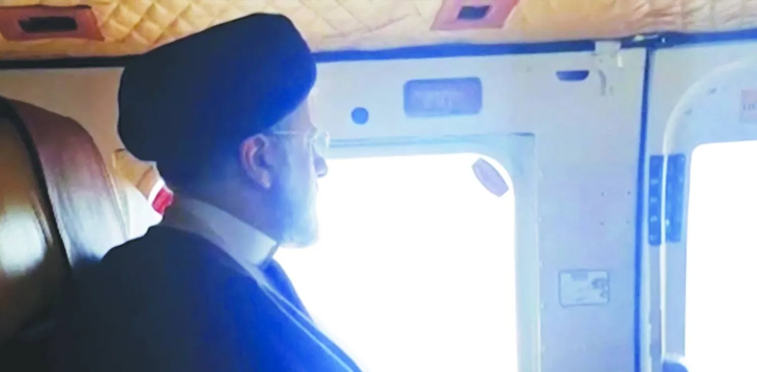 This grab taken from handout video footage released by the IRINN Iranian state television network on May 19, 2024 shows Iran's President Ebrahim Raisi on board a helicopter in the Jofa region of the western province of East Azerbaijan. (Photo by IRINN / AFP) 