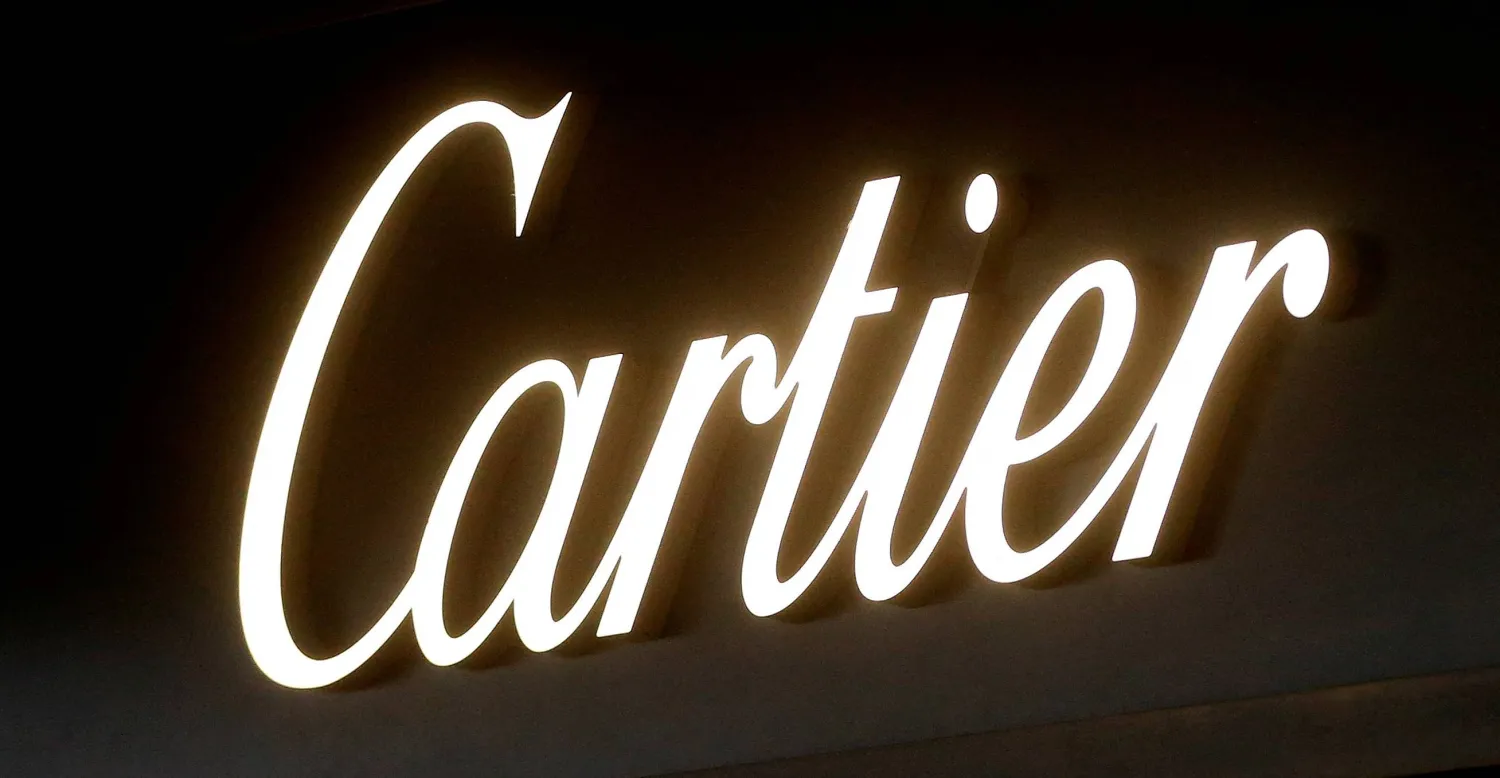 FILE PHOTO: The logo of luxury goods group Richemont's flagship brand Cartier is seen at a branch in Zurich, Switzerland, January 12, 2017.  REUTERS/Arnd Wiegmann/File Photo
