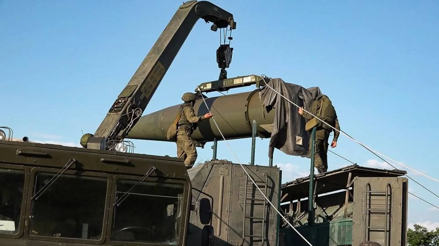 In this photo released by Russian Defense Ministry Press Service on Tuesday, May 21, 2024, Russian troops load an Iskander missile as part of drills to train the military for using tactical nuclear weapons at an undisclosed location in Russia. (Russian Defense Ministry Press Service via AP) 