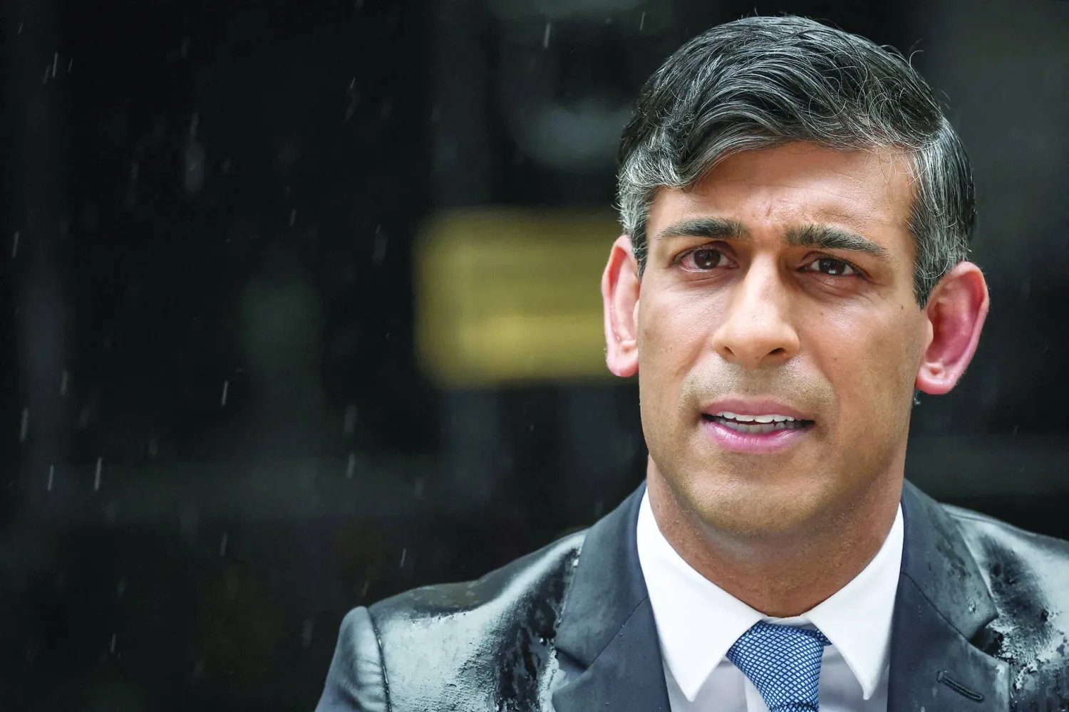 
سوناك لدى إعلانه موعد الانتخابات (أ.ف.ب)