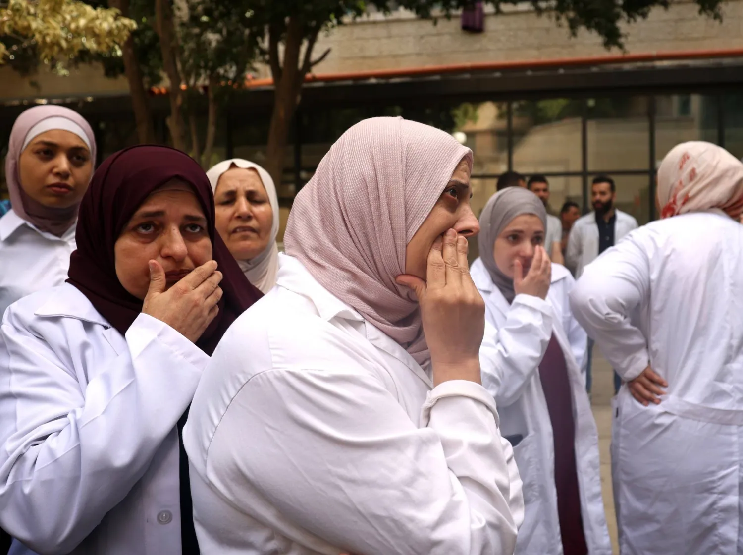 Palestinian doctors and hospital staff react during the funeral of Dr. Osayd Kamal Jabaren at Jenin Hospital in the West Bank city of Jenin, 23 May 2024. EPA/ALAA BADARNEH