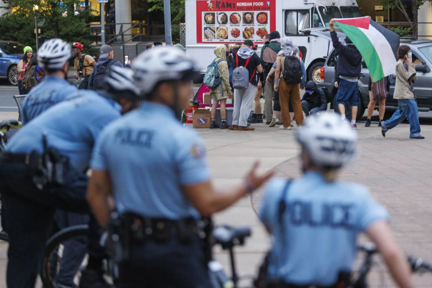 Police stand by as protestors prepare to leave a pro-Palestinian encampment at Drexel University early Thursday, May 23, 2004 in Philadelphia. (Alejandro A. Alvarez/The Philadelphia Inquirer via AP)