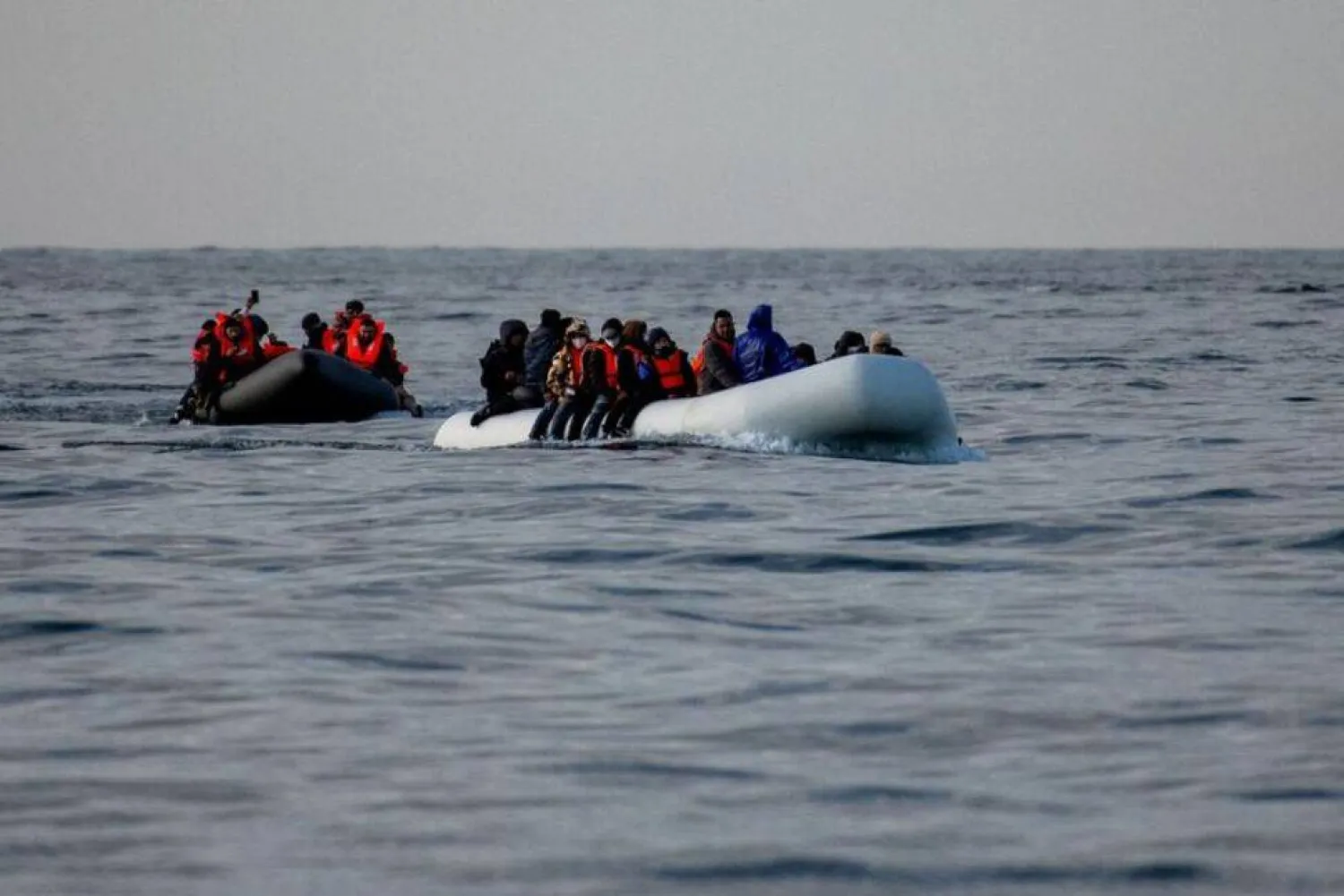 FILE PHOTO: Two inflatable dinghies carrying migrants make their way towards England in the English Channel, Britain, May 4, 2024. REUTERS/Chris J. Ratcliffe/File Photo