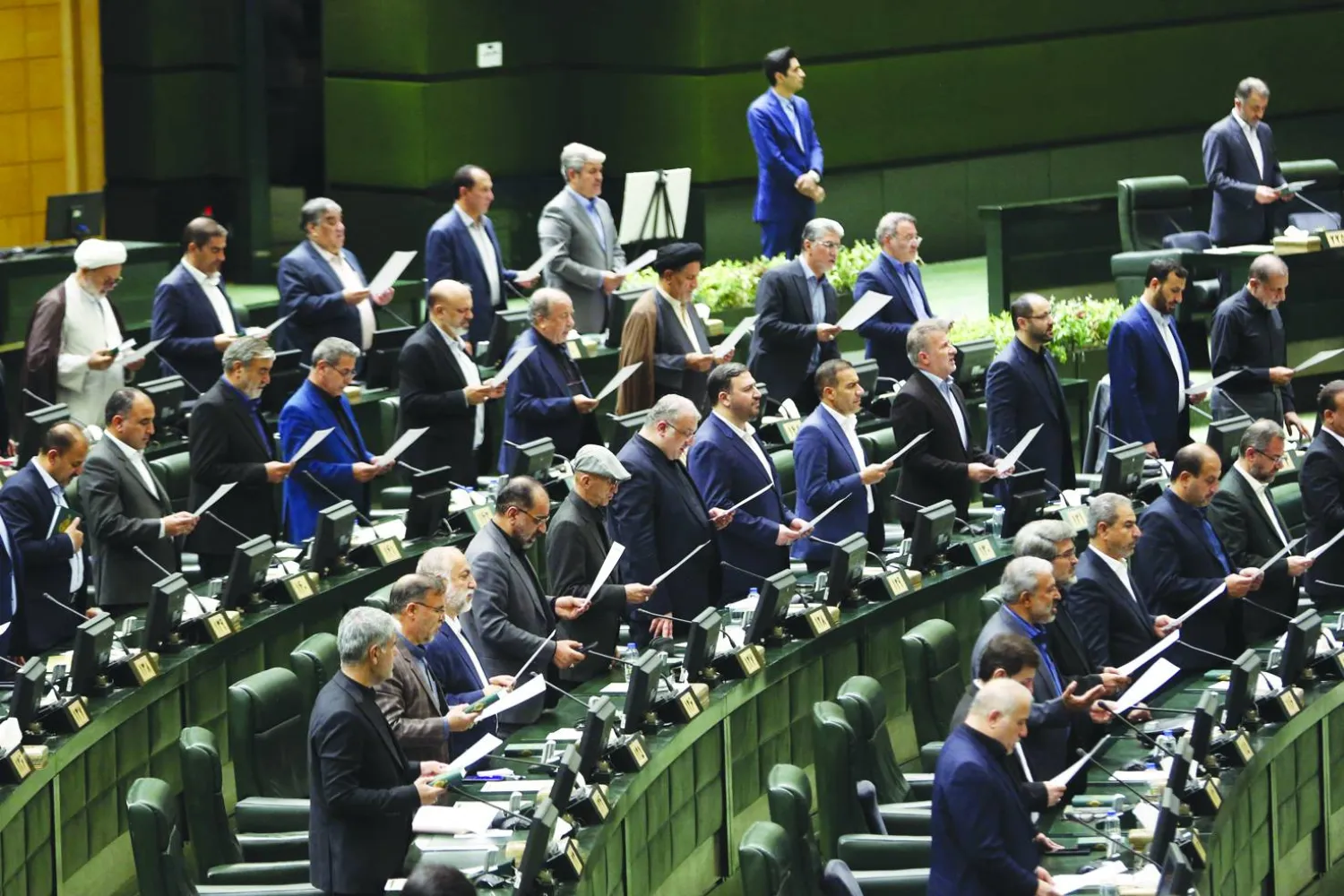  Iranian lawmakers attend the inauguration session for the new Parliament in Tehran on May 27, 2024. (Photo by AFP)