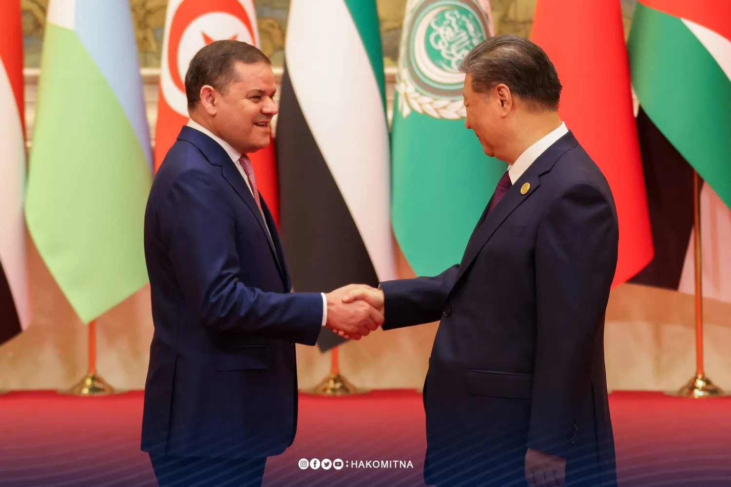 الدبيية مصافحاً نظيره الصيني (حكومة الوحدة الليبية المؤقتة)
