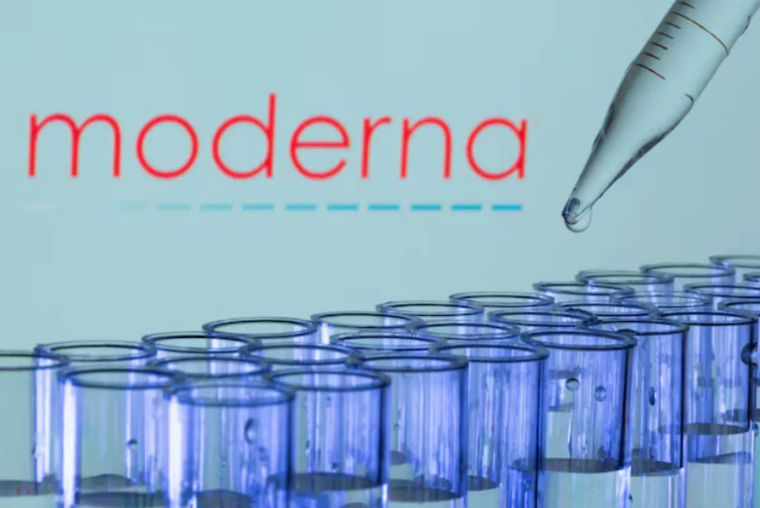 Test tubes are seen in front of a displayed Moderna logo in this illustration taken, May 21, 2021. REUTERS/Dado Ruvic/Illustration/File Photo Purchase Licensing Rights