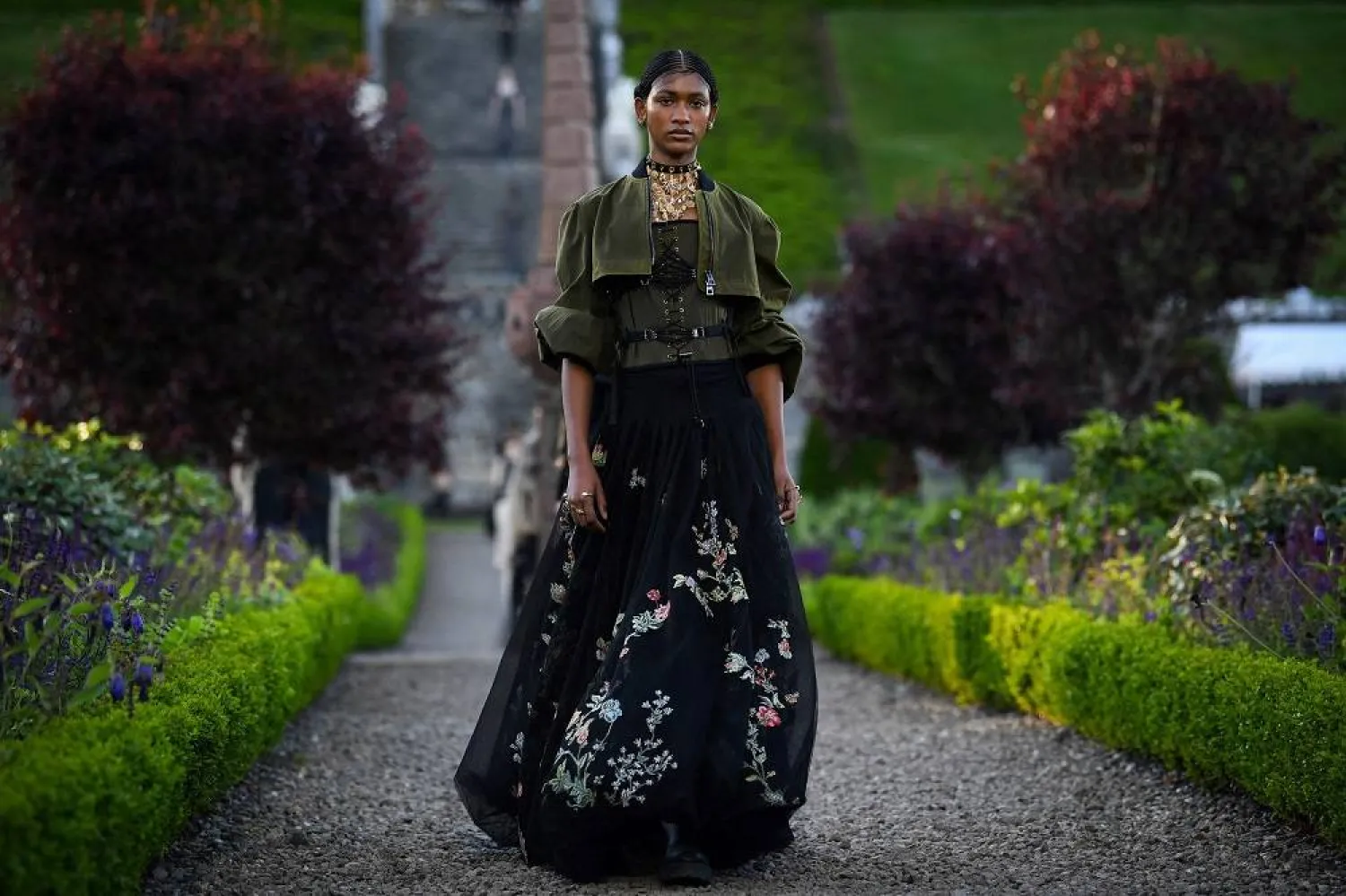 A model presents a creation for Dior during the 2025 Dior Croisiere (Cruise) fashion show on June 3, 2024 at Drummond Castle, in Crieff, in Scotland. (AFP)