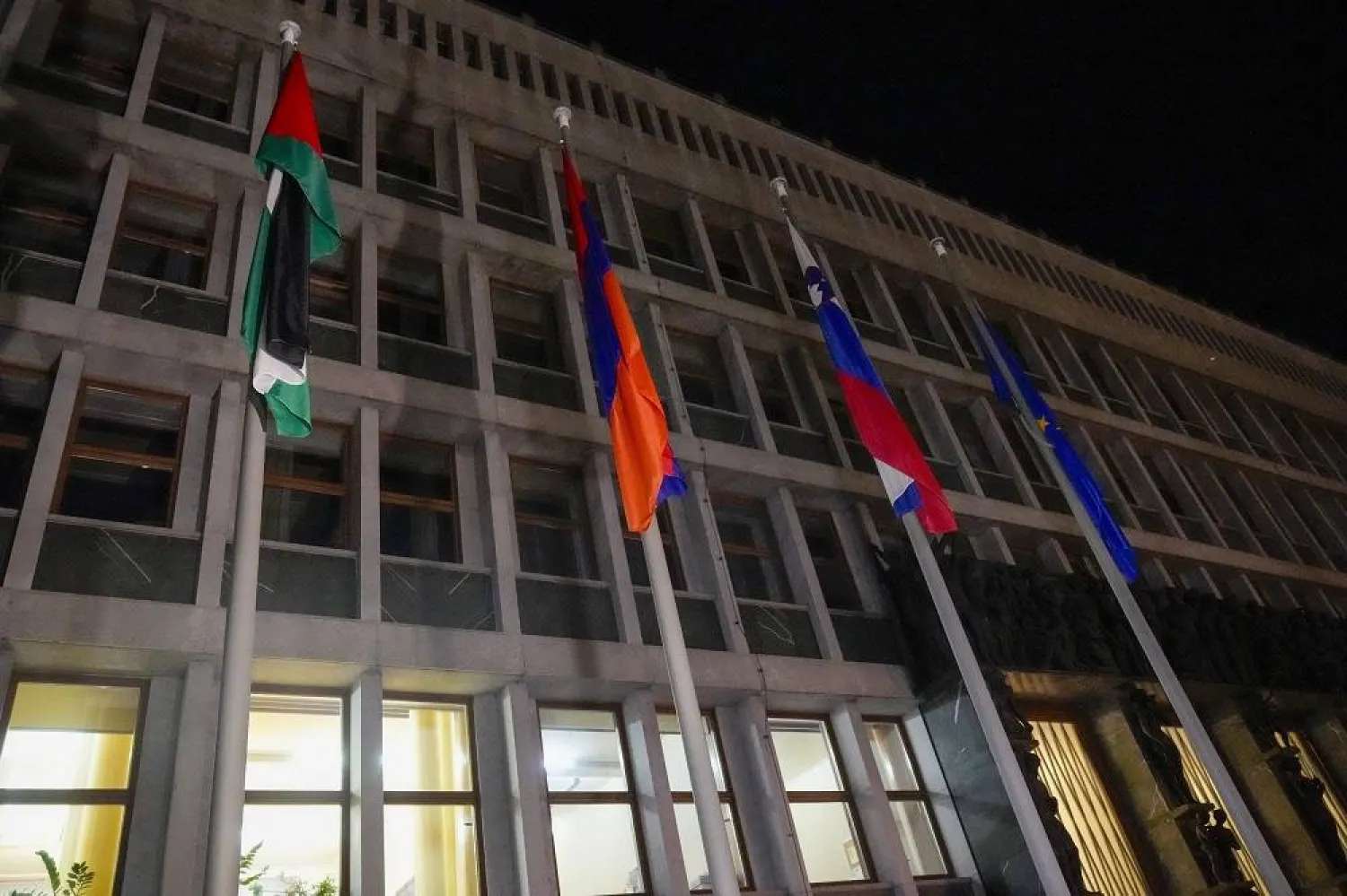 The Palestinian flag is raised in front of the Slovenian parliament building after the vote in Ljubljana, Slovenia, Tuesday, June 4, 2024. (AP) 
