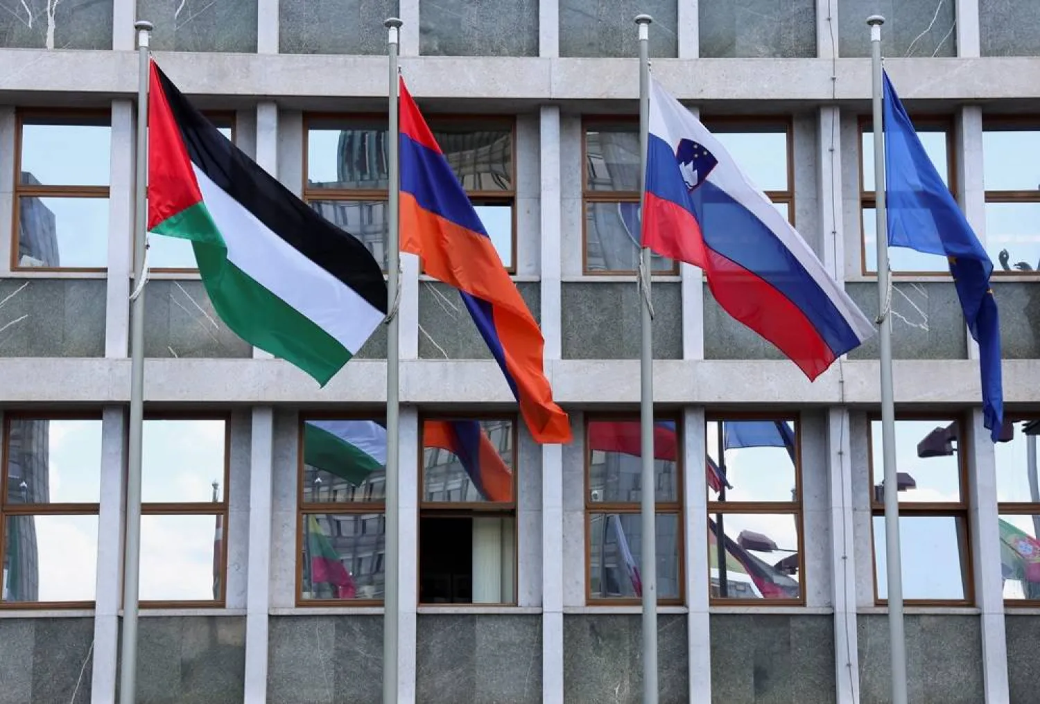  A Palestinian flag flutters among other flags in front of the Slovenian parliament after Slovenia recognized a Palestinian state, in Ljubljana, Slovenia, June 5, 2024. (Reuters)