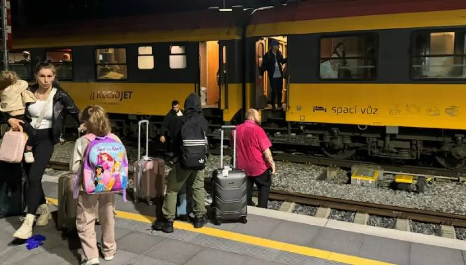 People stand near a train following a collision between a passenger train and a freight train in Pardubice, Czech Republic, June 5, 2024 in this picture obtained from social media. Jiri Sejkora/via REUTERS