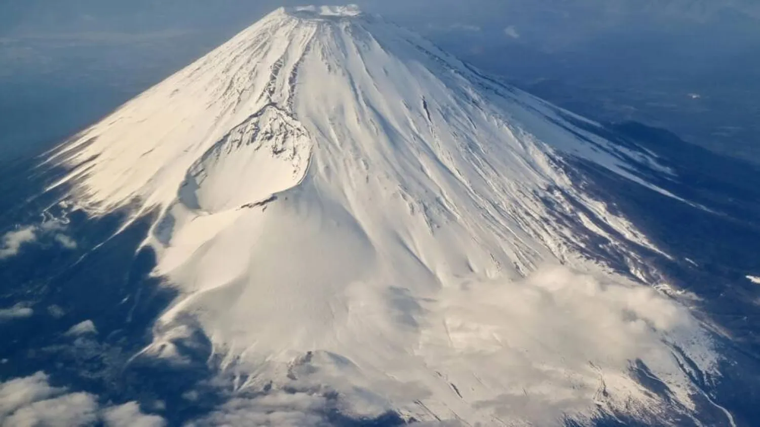 Tourists are flocking to take photos of Japan's highest peak Mount Fuji. Richard A. Brooks / AFP
