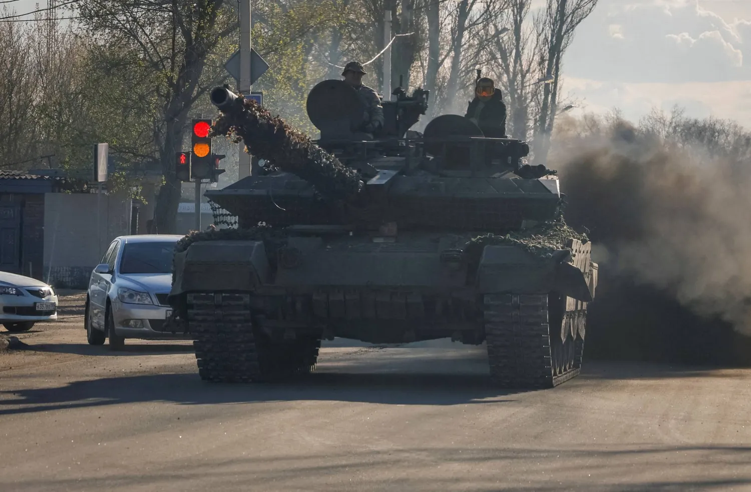 FILE PHOTO: Russian army servicemen drive a tank on a street in Donetsk, Russian-controlled Ukraine, April 6, 2024. REUTERS/Alexander Ermochenko/File Photo