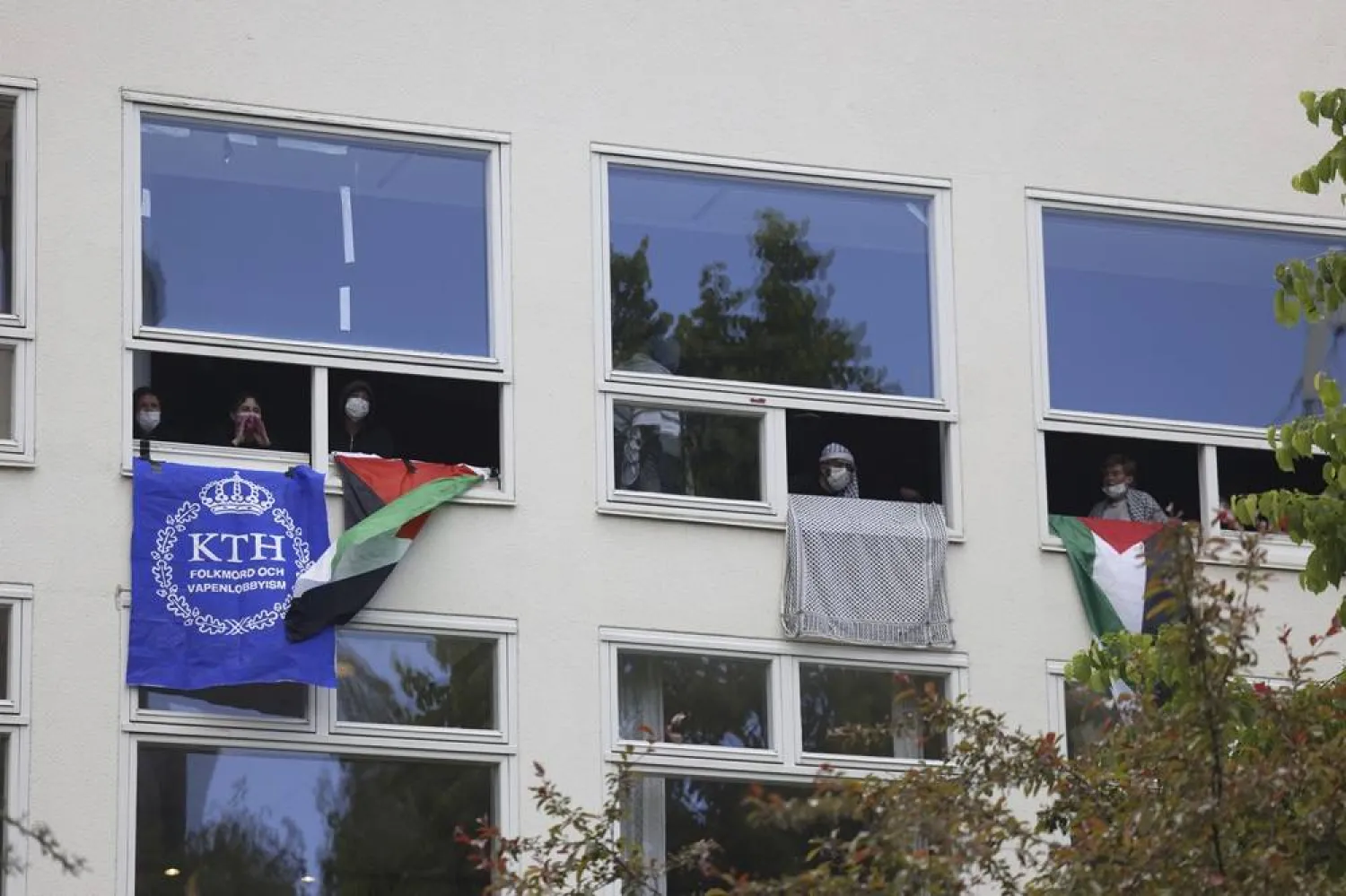 Pro-Palestinian activists barricade themselves in a building at the Royal Institute of Technology (KTH) in Stockholm, Friday June 7, 2024. (Fredrik Persson/TT News Agency via AP) 