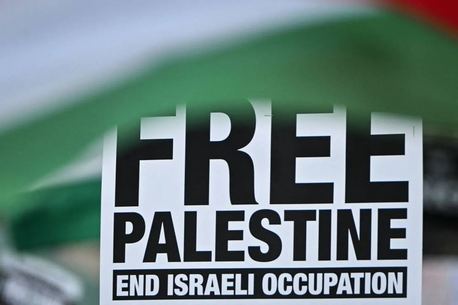 A placard reading "Free Palestine, end Israel Occupation" is pictured on Parliament square, central London, on June 8, 2024 at the end of "National March for Gaza", calling to "end the genocide" and "stop arming Israel". (AFP)