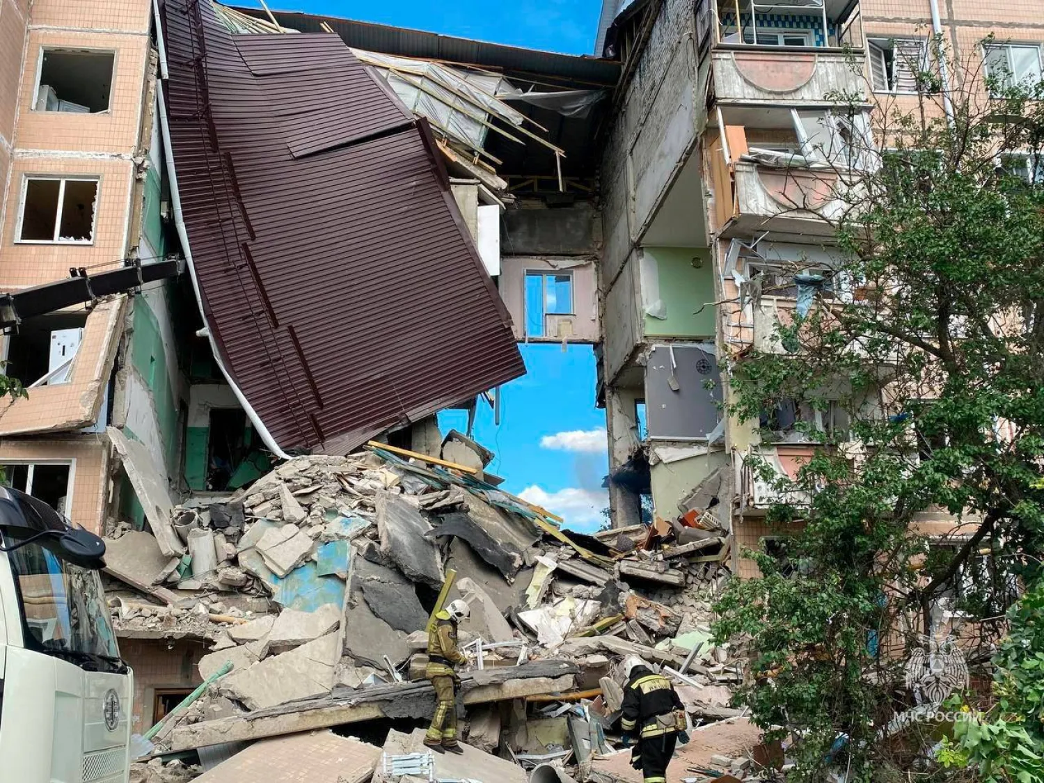 Rescuers remove debris following the collapse of a section of a multi-story apartment block, as the result of what local authorities called a Ukrainian missile strike, in the course of the Russia-Ukraine conflict in the town of Shebekino in the Belgorod region, Russia, June 14, 2024. Russian Emergencies Ministry/Handout via REUTERS 