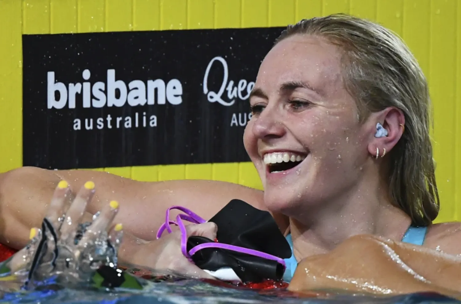 Ariarne Titmus reacts after winning the final of the Women’s 200m Freestyle during the 2024 Australian Swimming Trials at the Brisbane Aquatic Centre in Brisbane, Wednesday, June 12, 2024. Titmus set a world record in the women’s 200-meter freestyle on Wednesday at Australia’s Olympic swimming trials on Wednesday.(Jono Searle/AAP Image via AP)

