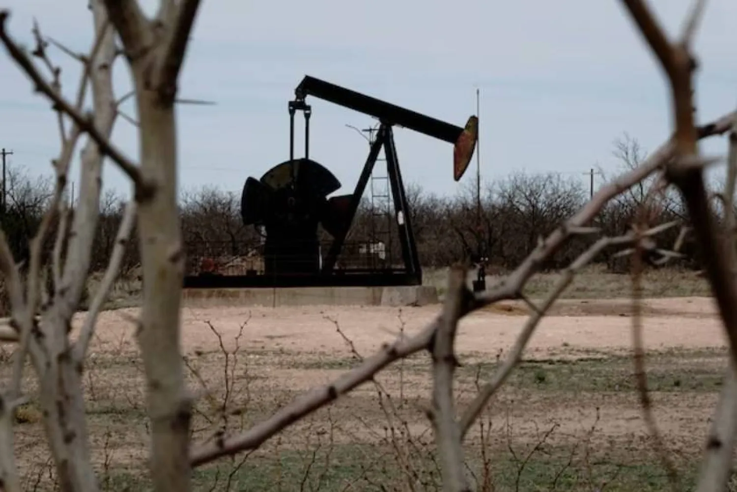 A pump jack drills oil crude from the Yates Oilfield in West Texas’s Permian Basin, near Iraan, Texas, US, March 17, 2023. REUTERS/Bing Guan/File Photo