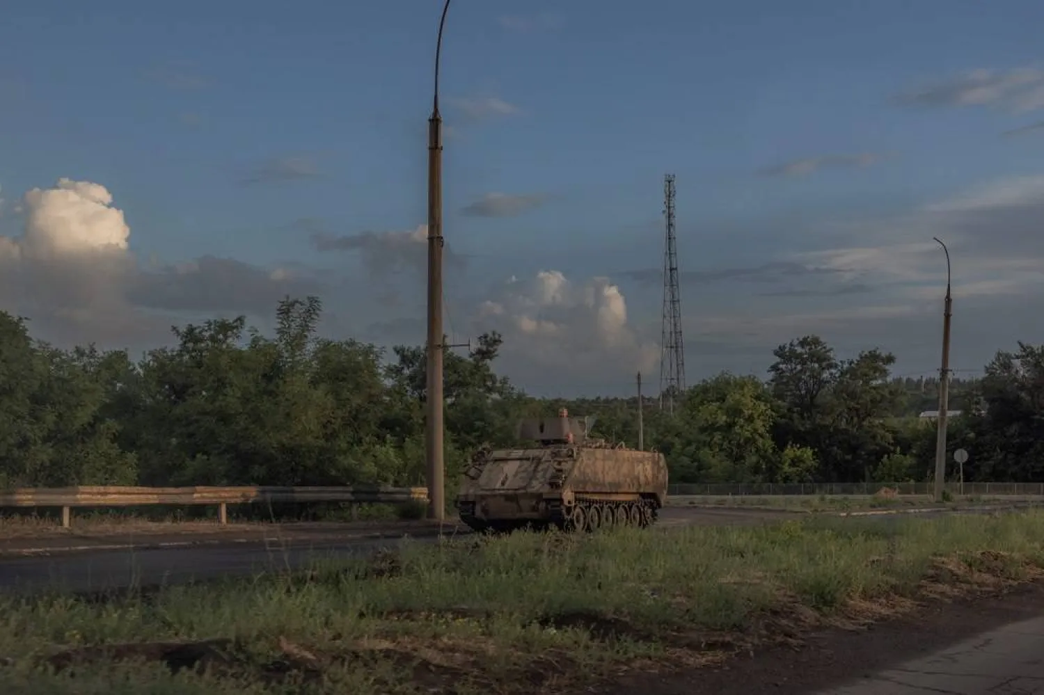  A US-made M113 armored personnel carrier runs on a road in the Donetsk region, on June 16, 2024, amid the Russian invasion of Ukraine. (AFP) 