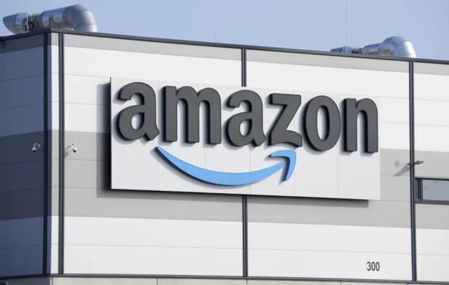 FILE - An Amazon company logo is seen on the facade of a company's building in Schoenefeld near Berlin, Germany, on March 18, 2022. (AP Photo/Michael Sohn, File)
