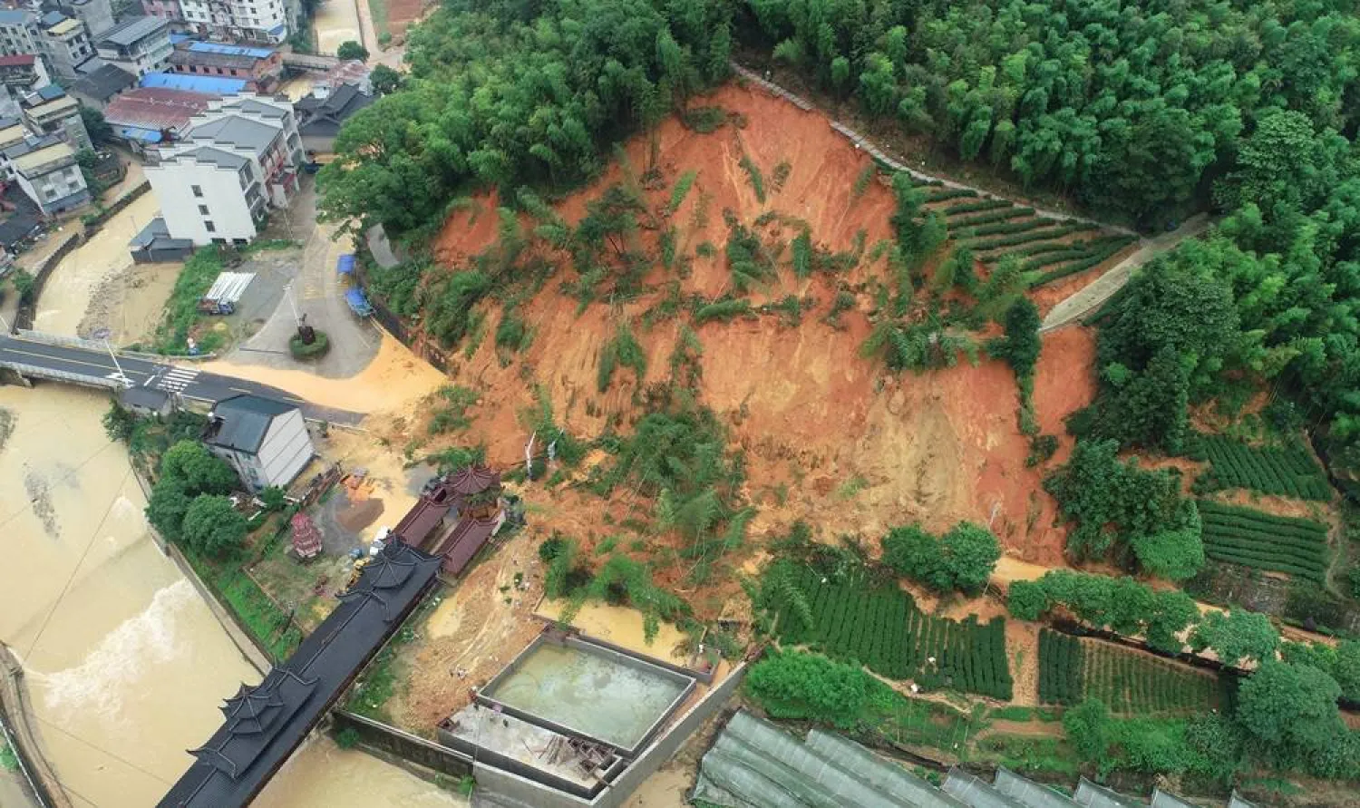An aerial drone photo taken on 16 June 2024 shows an area affected by torrential rains in Tieshan Township of Zhenghe County, Nanping City, China's Fujian Province, 16 June 2024. (Xinhua/EPA)