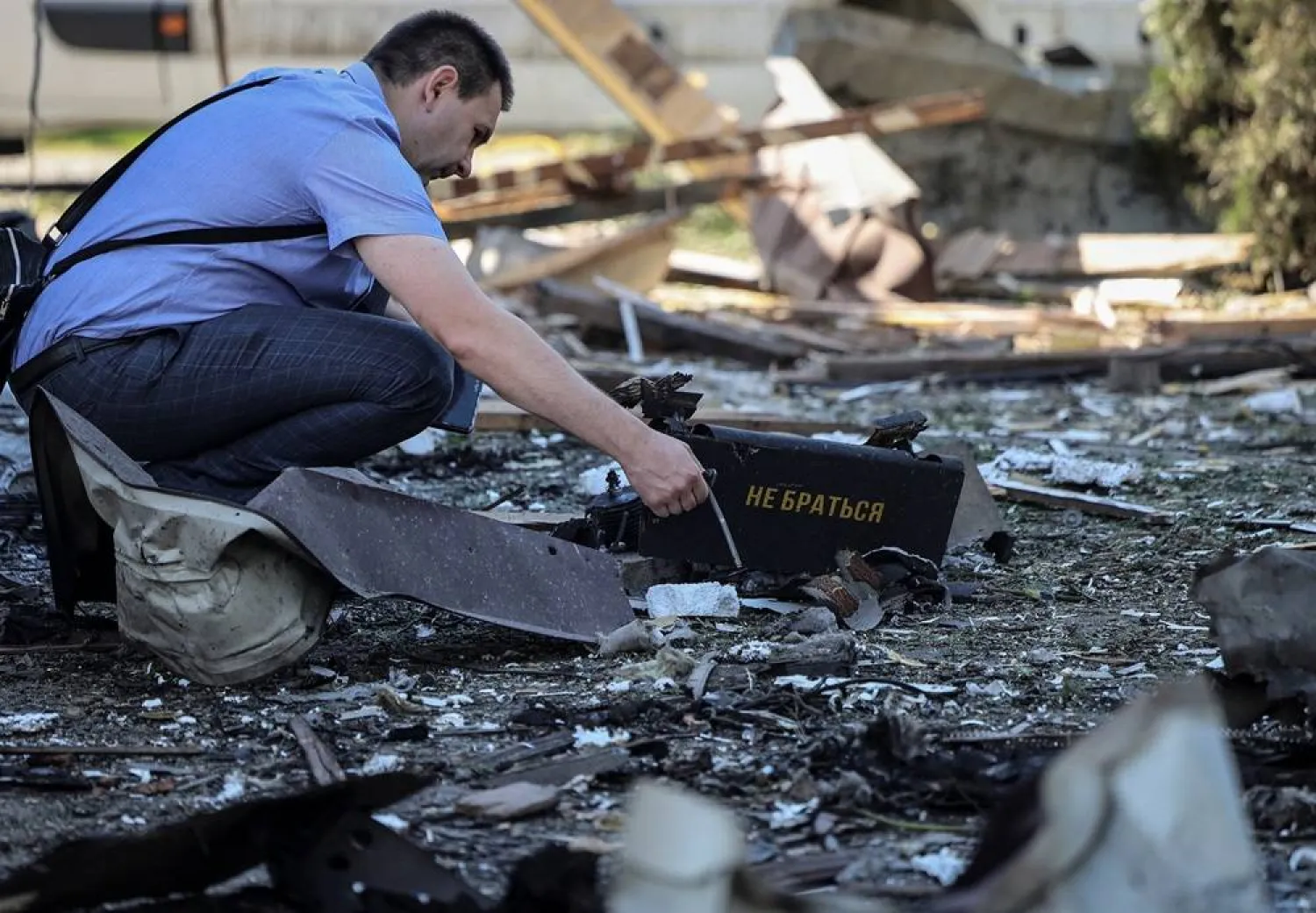  A war crimes prosecutor works at a site of a Russian drone attack, amid Russia's attack on Ukraine, on the outskirts of Lviv, Ukraine June 19, 2024. (Reuters)