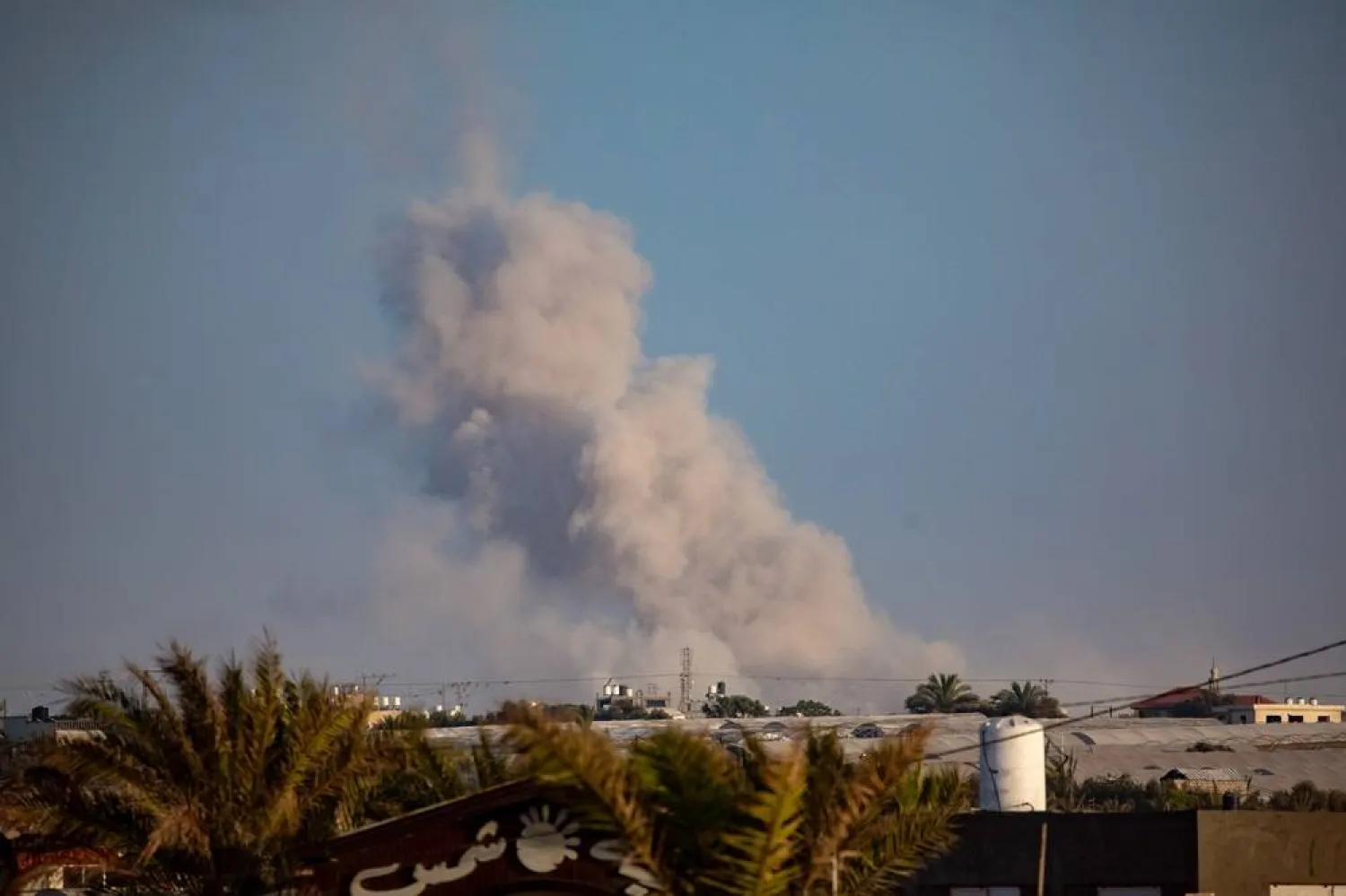 Smoke rises after an Israeli air strike on Rafah, southern Gaza Strip, 23 June 2024. (EPA)