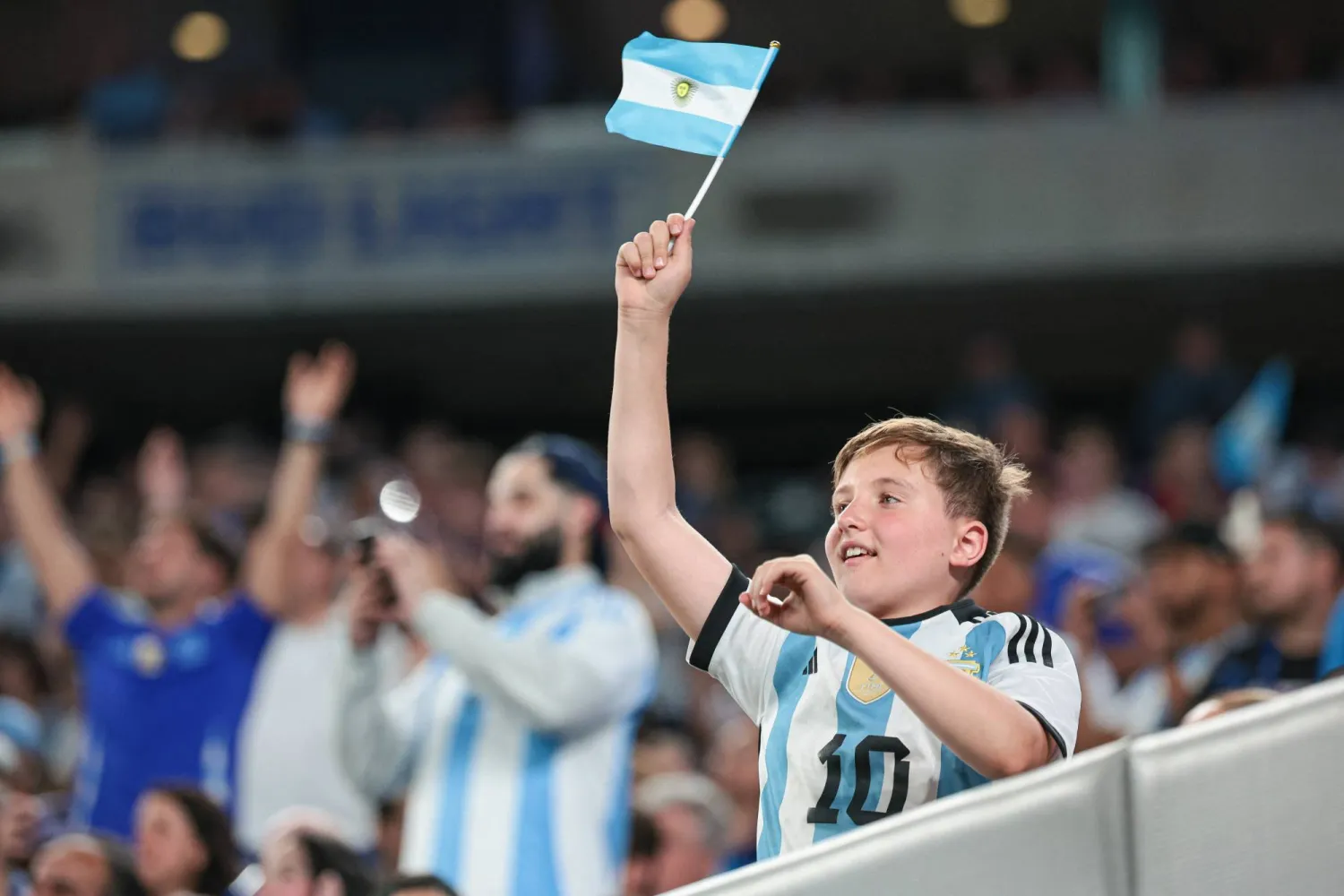 Jun 25, 2024; East Rutherford, NJ, USA; A young fan cheers during the match between Argentina and Chile during the second half at MetLife Stadium. Mandatory Credit: Vincent Carchietta-USA TODAY Sports