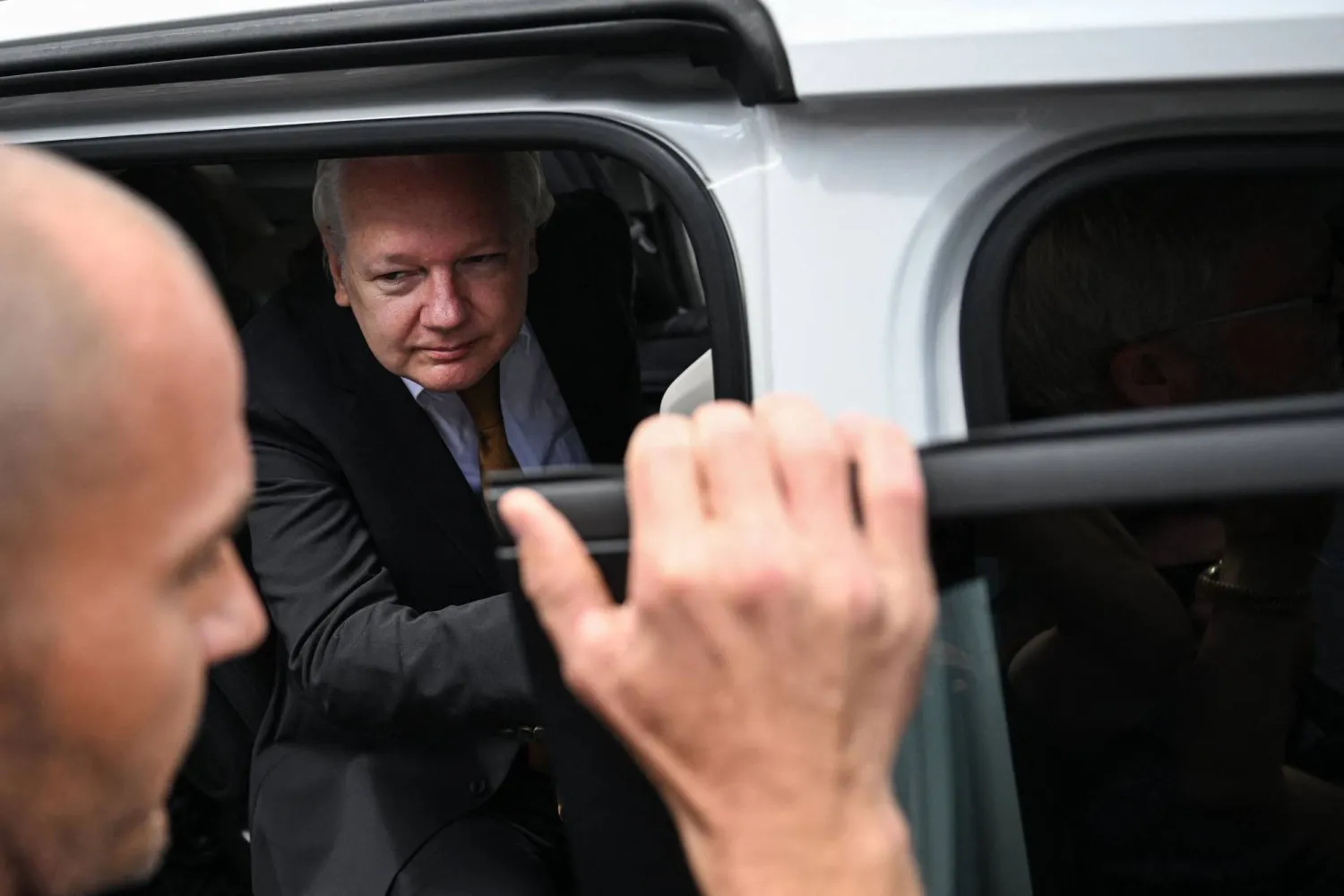 WikiLeaks founder Julian Assange leaves the US Federal Courthouse in the Commonwealth of the Northern Mariana Islands in Saipan, Northern Mariana Islands, on June 26, 2024. (Photo by Yuichi YAMAZAKI / AFP)