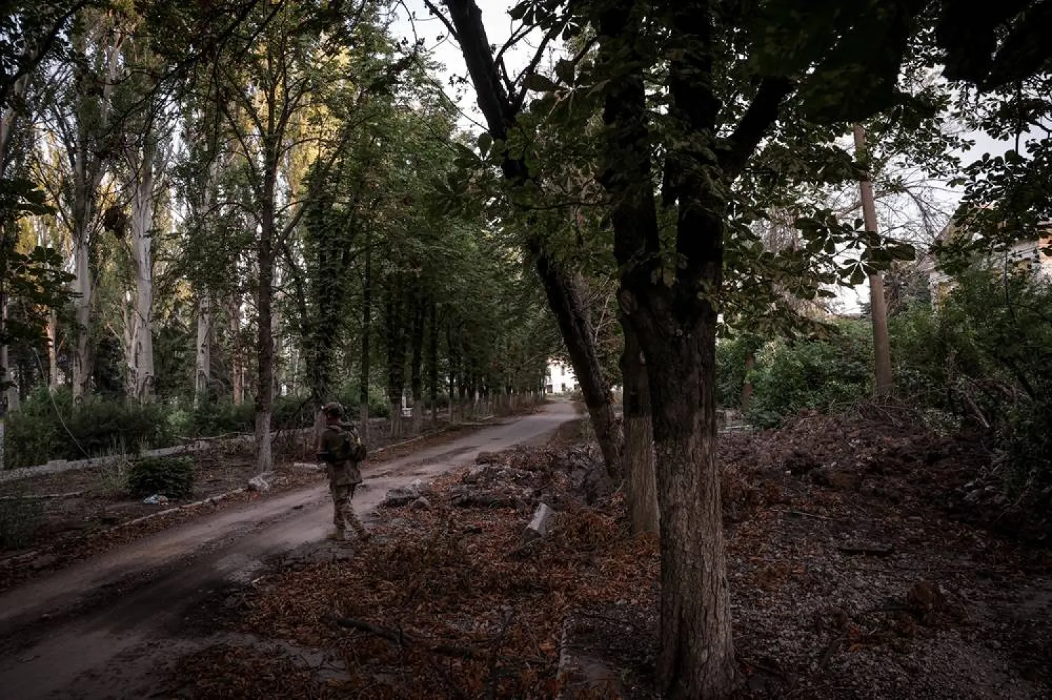 A serviceman of 24th Mechanized brigade named after King Danylo of the Ukrainian Armed Forces crosses the street, amid Russia's attack on Ukraine, in the frontline town of Chasiv Yar in Donetsk region, Ukraine June 25, 2024. Oleg Petrasiuk/Press Service of the 24th King Danylo Separate Mechanized Brigade of the Ukrainian Armed Forces/Handout via Reuters 