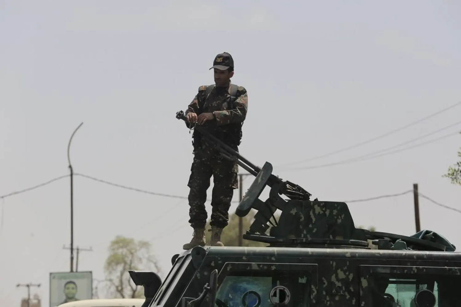 A Houthi member stands on an armored personnel carrier while on patrol in Sanaa, Yemen, 24 June 2024. (EPA)