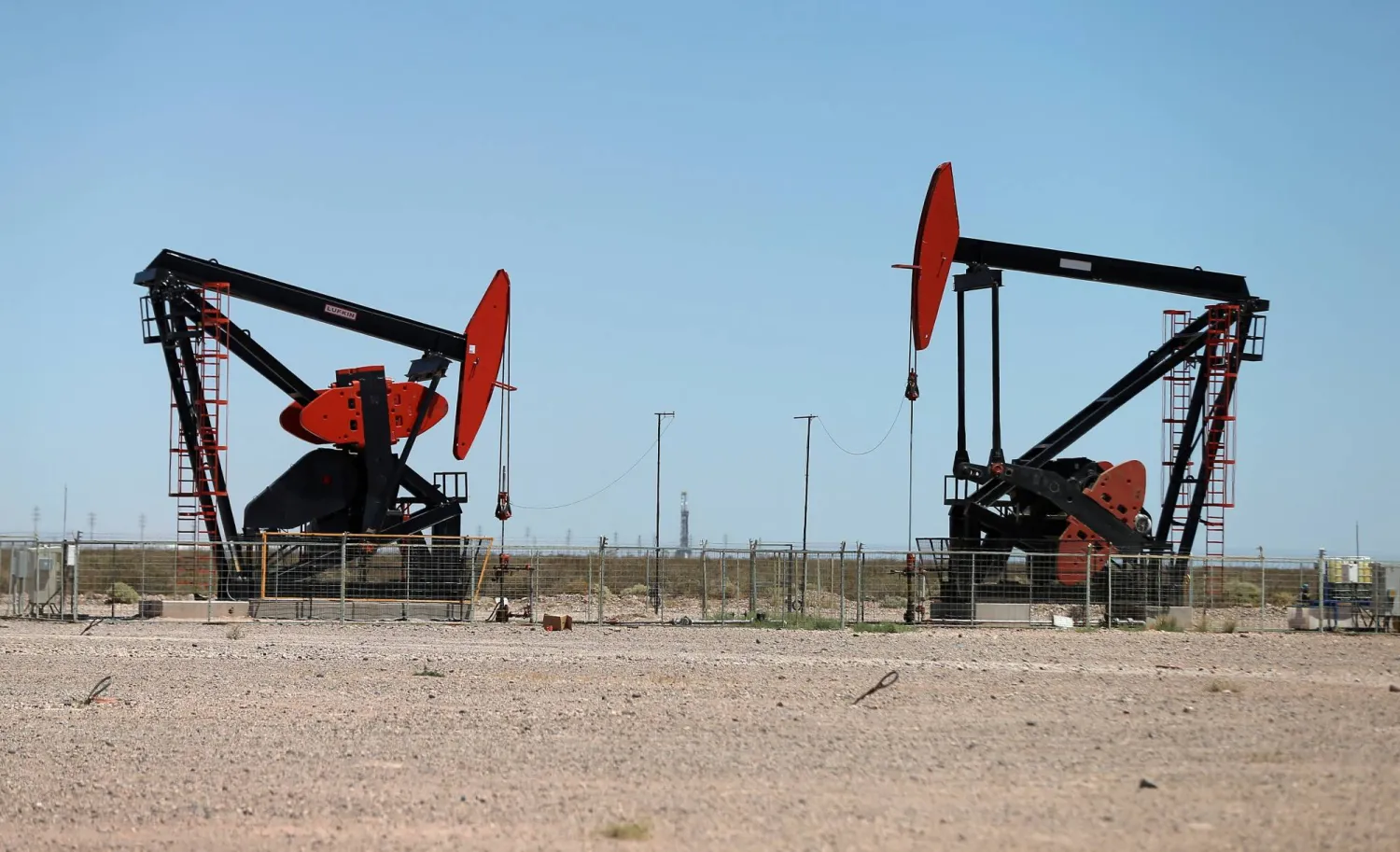 FILE PHOTO: Oil pump jacks are seen at Vaca Muerta shale oil and gas drilling, in the Patagonian province of Neuquen, Argentina January 21, 2019. REUTERS/Agustin Marcarian/File Photo