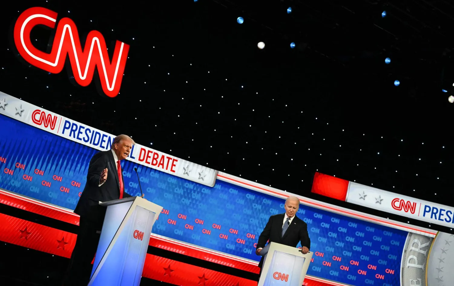 US President Joe Biden and former US President and Republican presidential candidate Donald Trump participate in the first presidential debate of the 2024 elections at CNN's studios in Atlanta, Georgia, on June 27, 2024. (Photo by ANDREW CABALLERO-REYNOLDS / AFP)