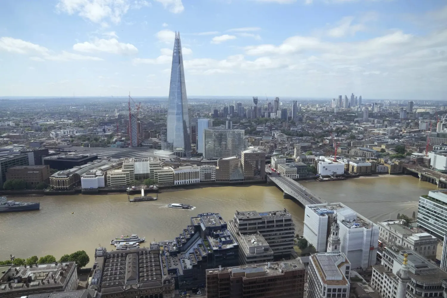 A general view of London's south bank of the River Thames including the city's tallest building the Shard, in London, Thursday, June 27, 2024. (AP Photo/Kin Cheung, Pool)