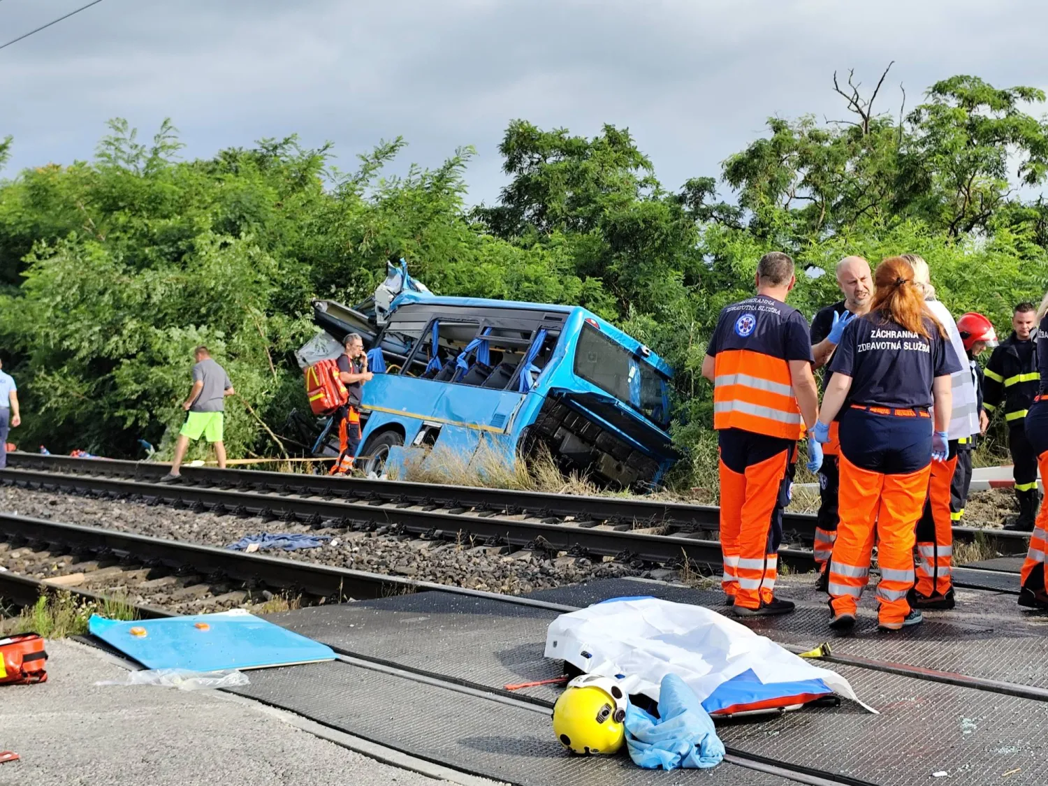 Emergency personnel work at the site of a train crash with a bus near Nove Zamky, Slovakia, June 27, 2024. Robert Novak/Handout via REUTERS
